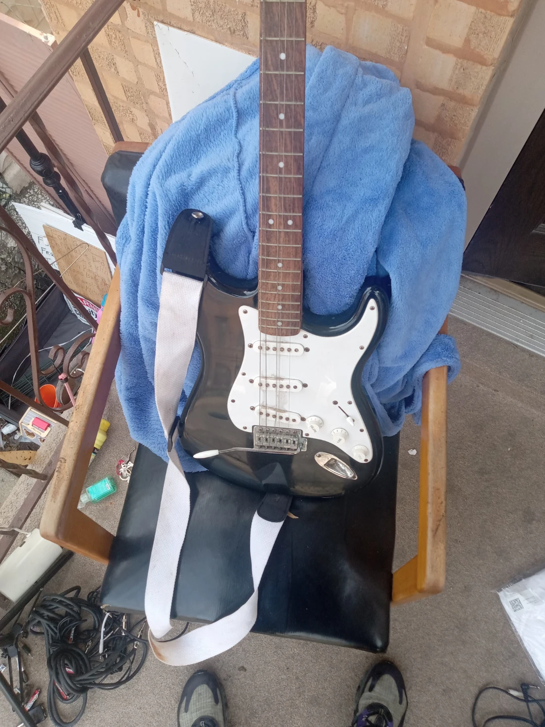 Black Electric Guitar with White Pickguard