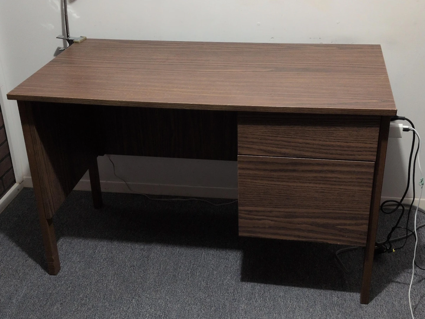 Brown wood desk with drawers