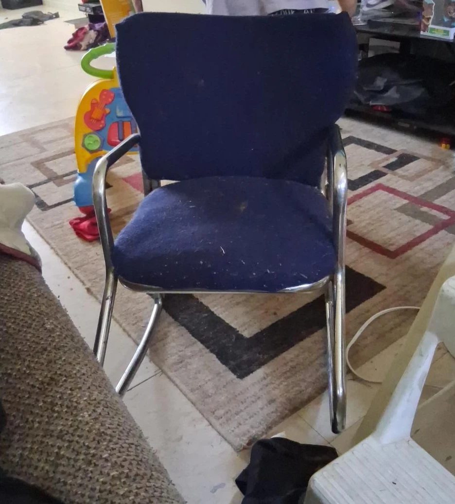 Blue upholstered chair with chrome legs