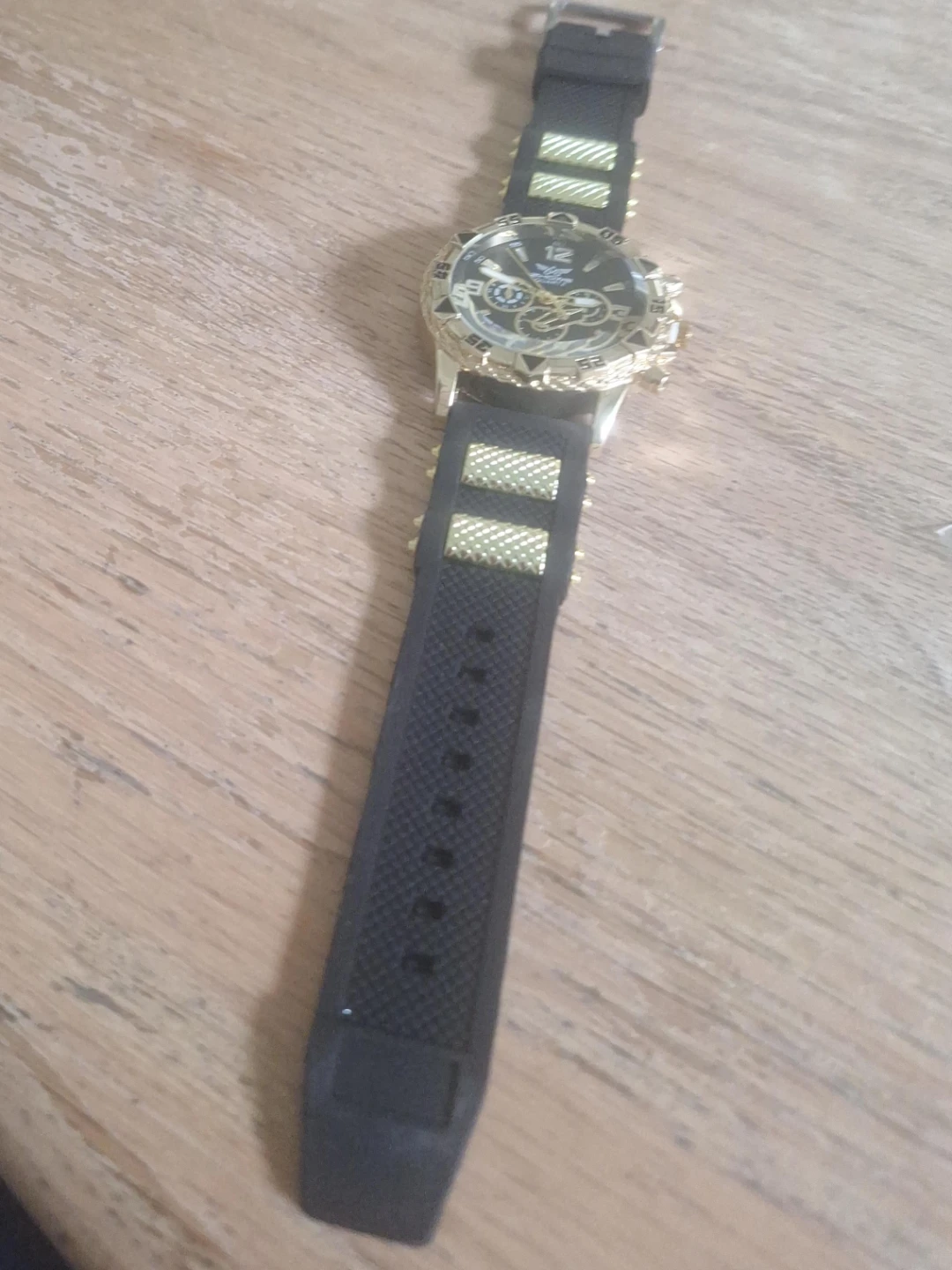 Men's Gold and Black Watch Also w