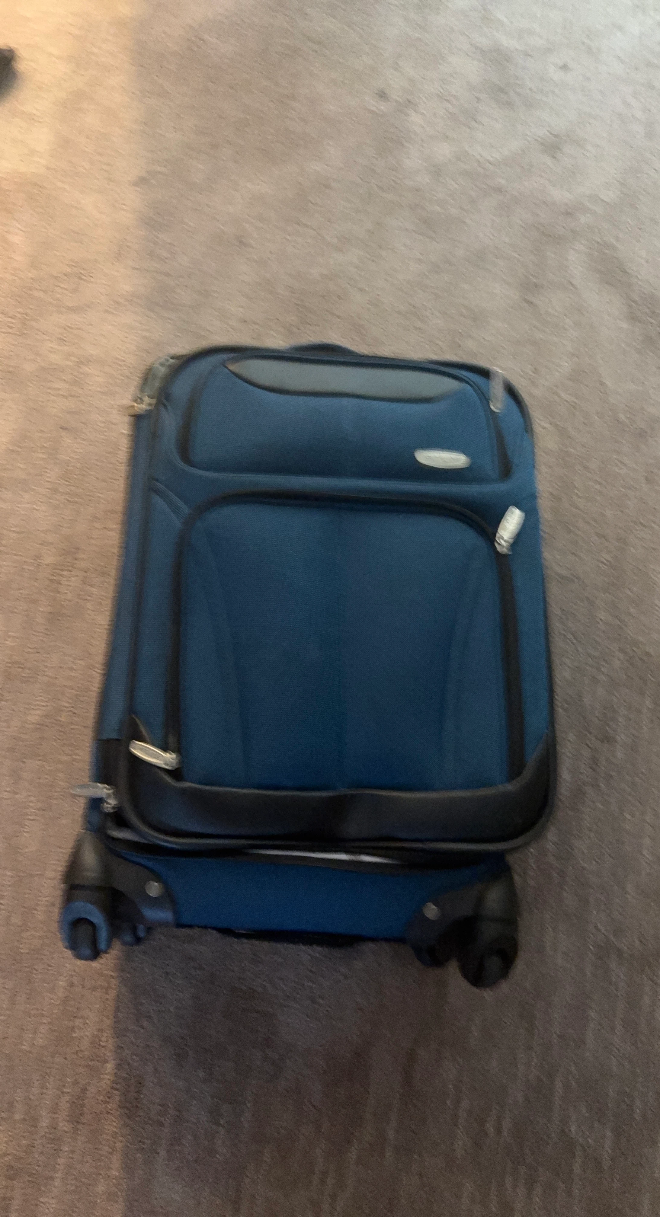 American Tourister Rolling Suitcase