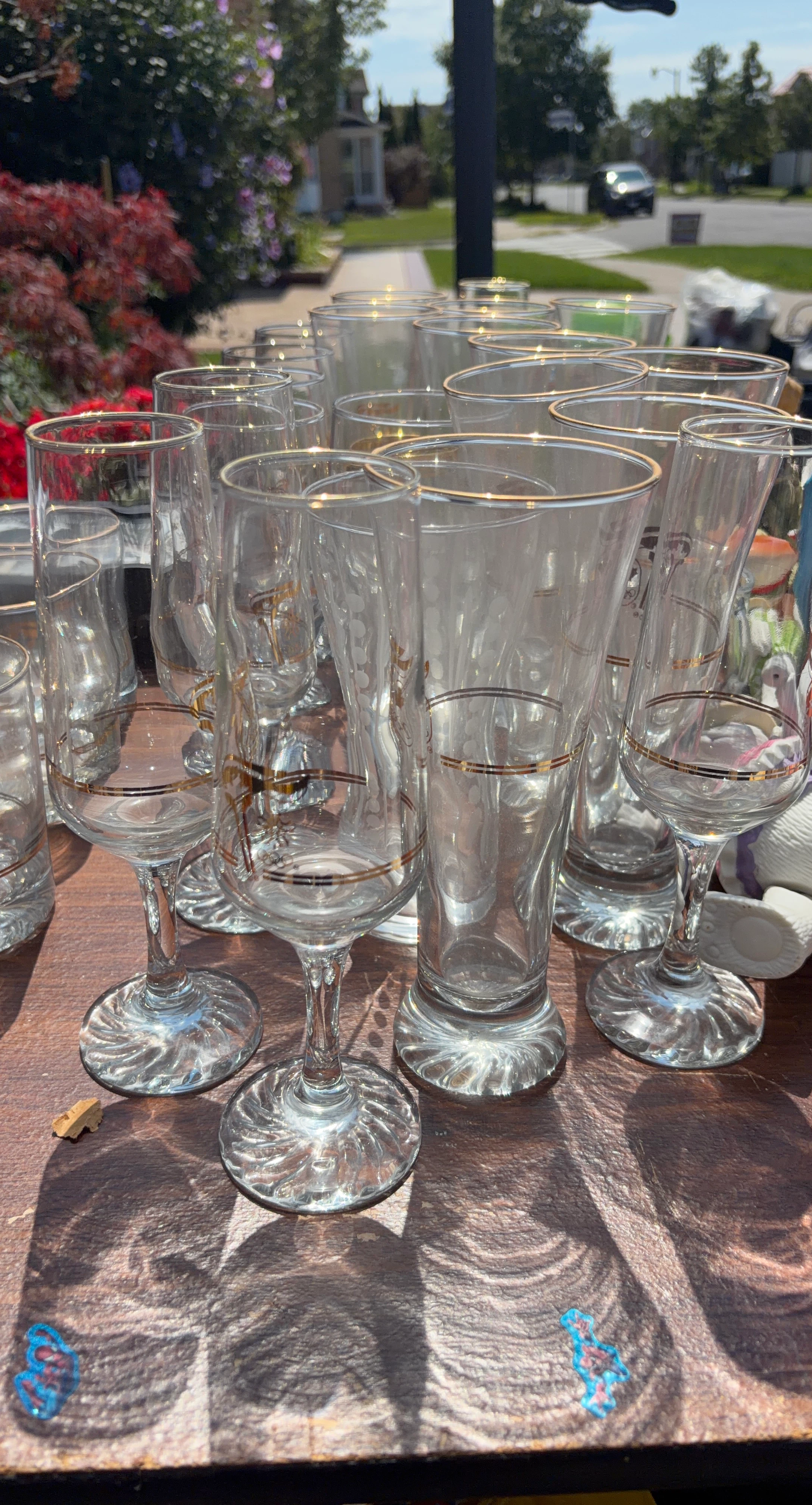 Set of assorted stemmed gold-rimmed glasses