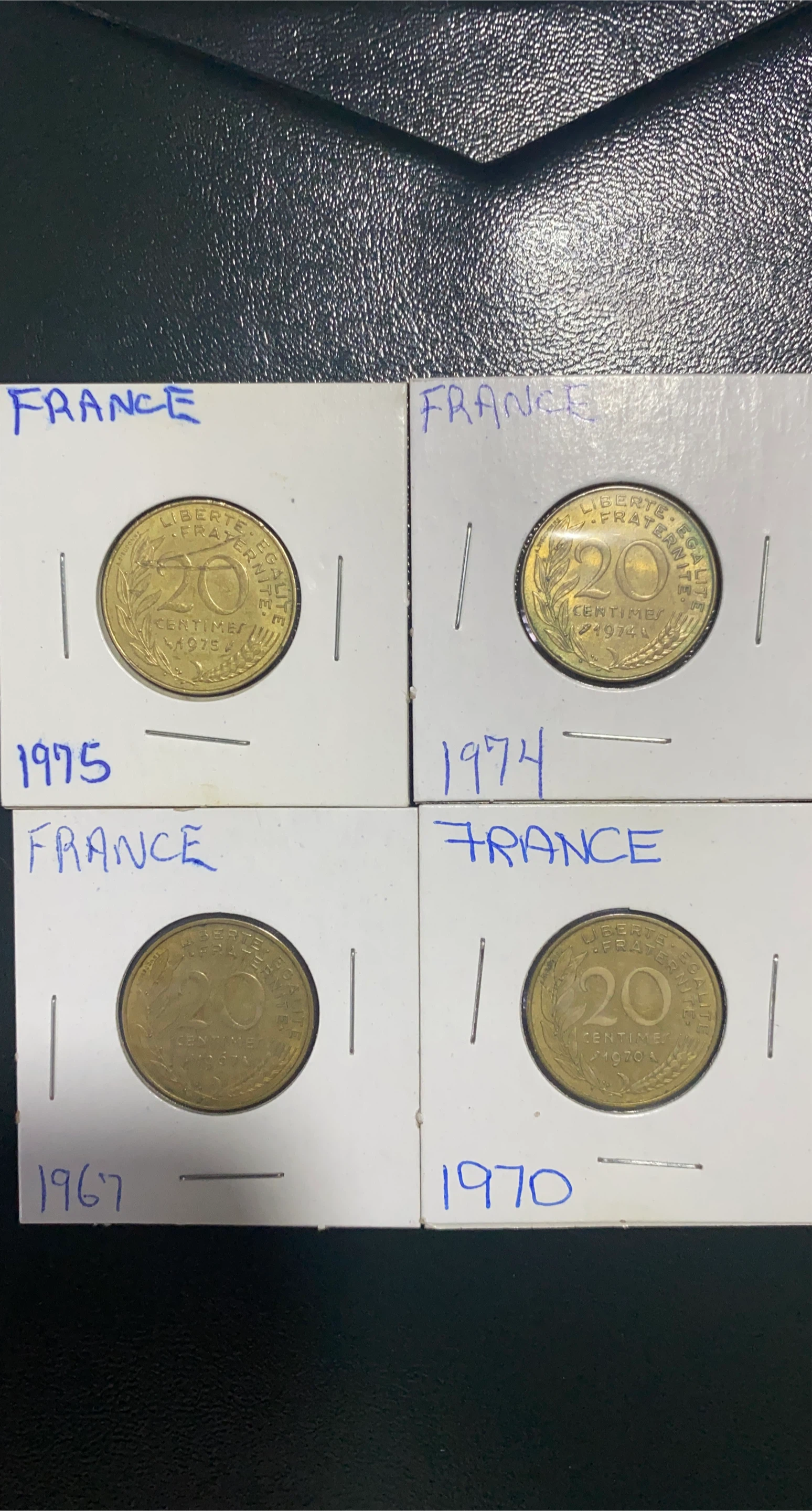 Four French 20 Centimes Coins