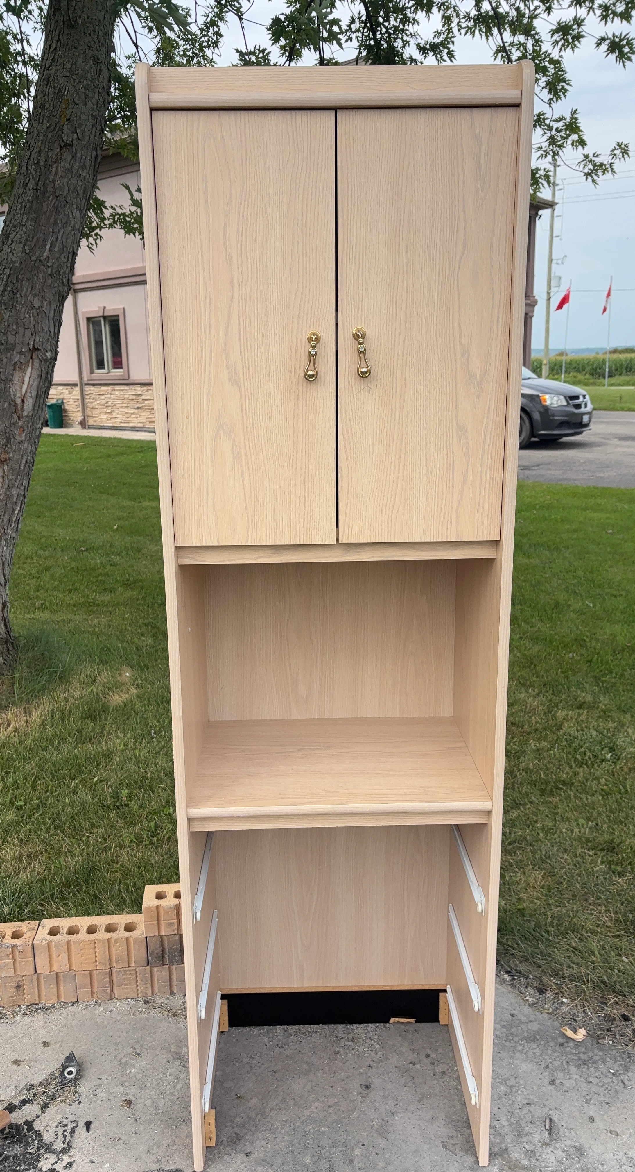 Light Wood Cabinet with Doors and Shelves