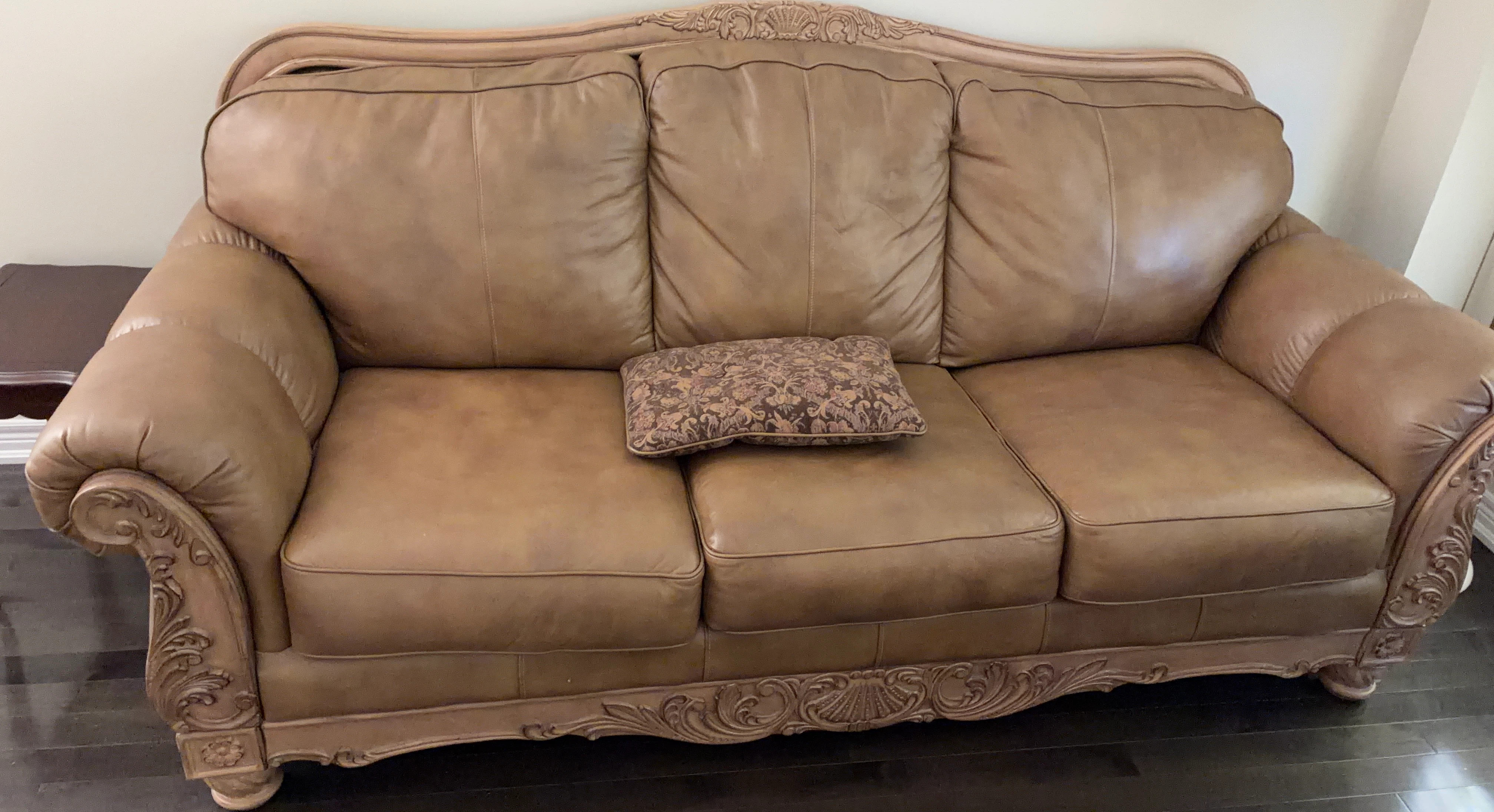 Ashley Brown Leather Sofa with Ornate Carvings