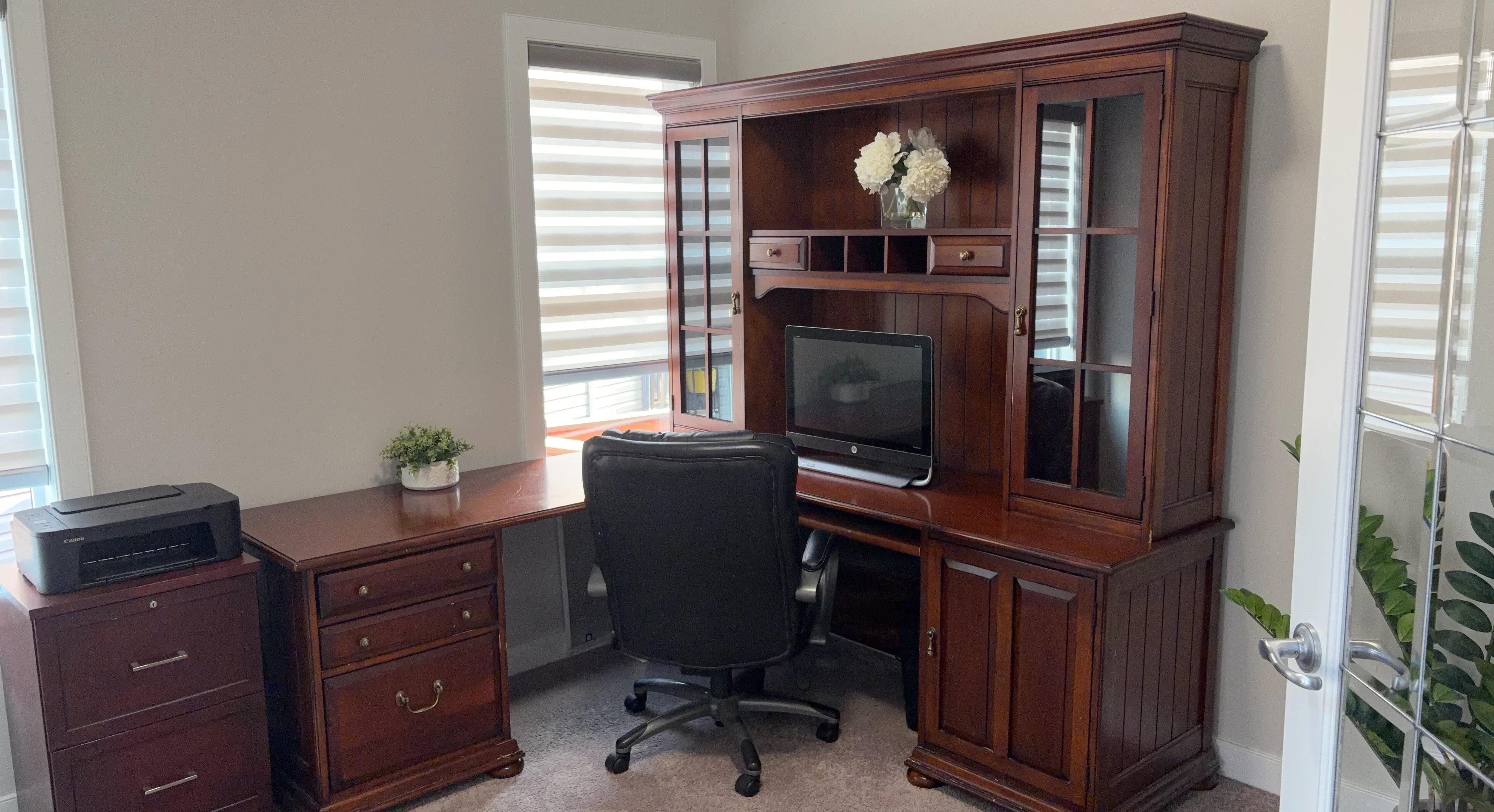 Large wooden corner desk with hutch