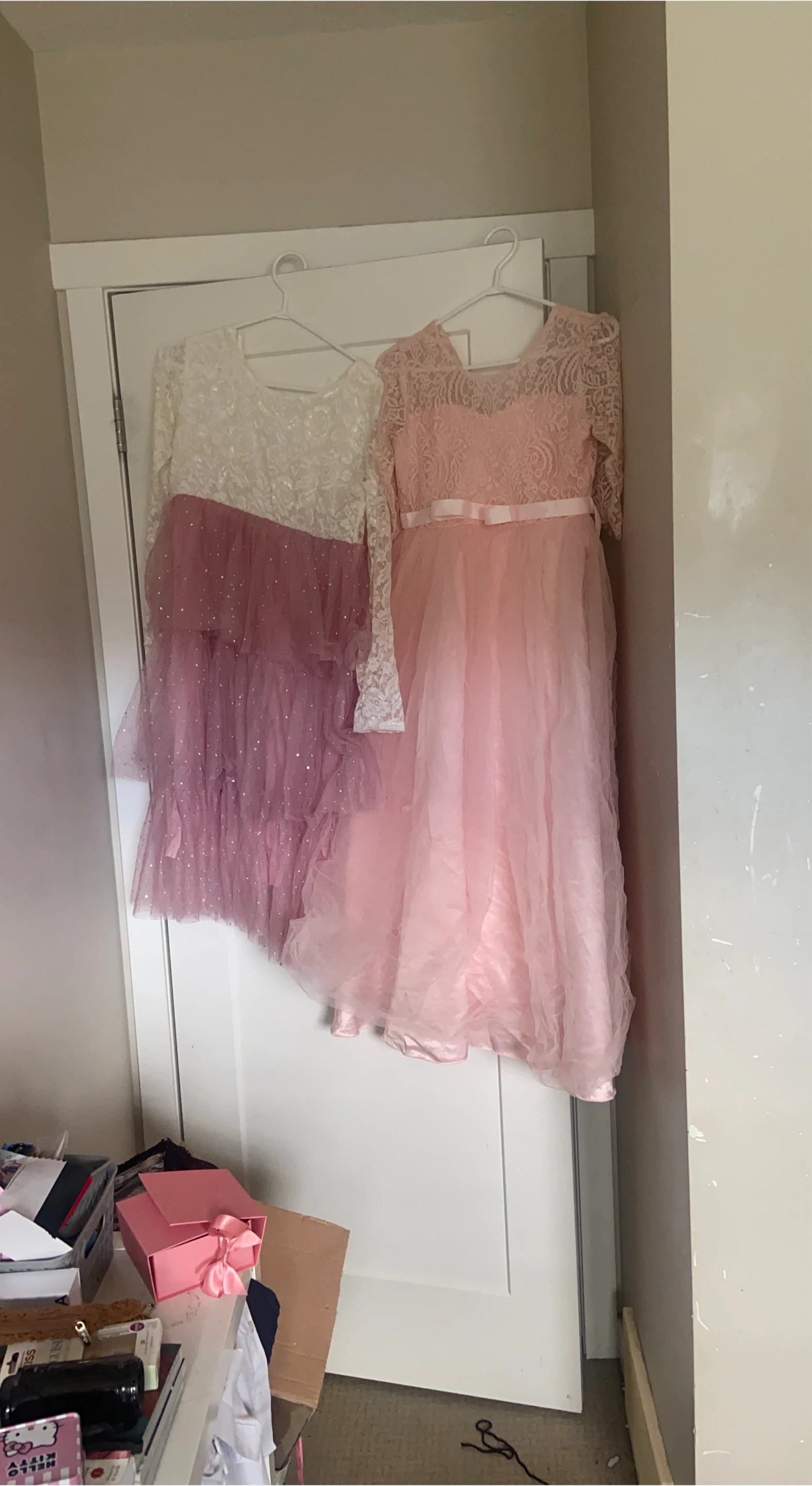 Two pink and white lace flower girl dresses