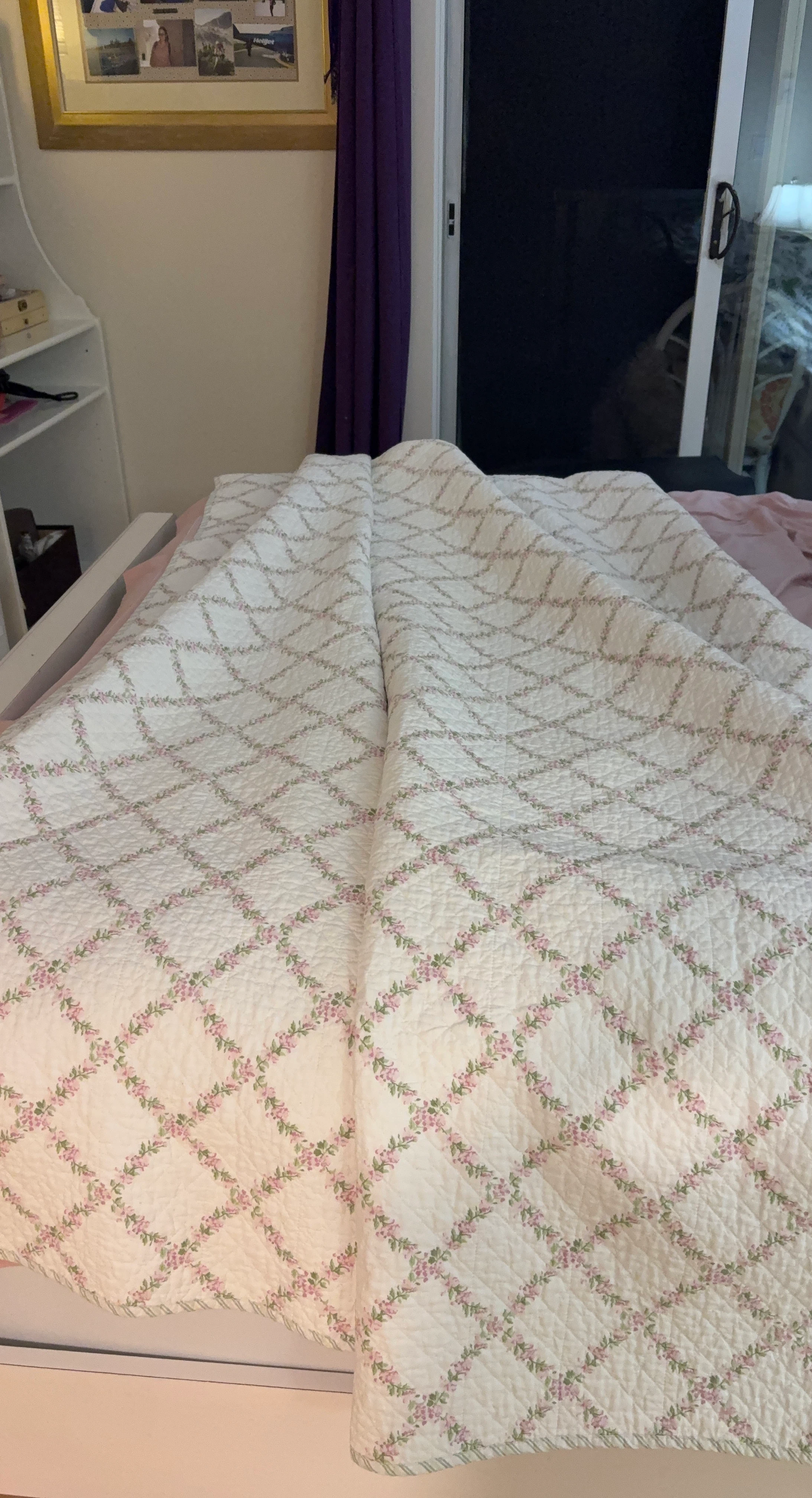 White Quilted Bedspread with Pink Floral Pattern