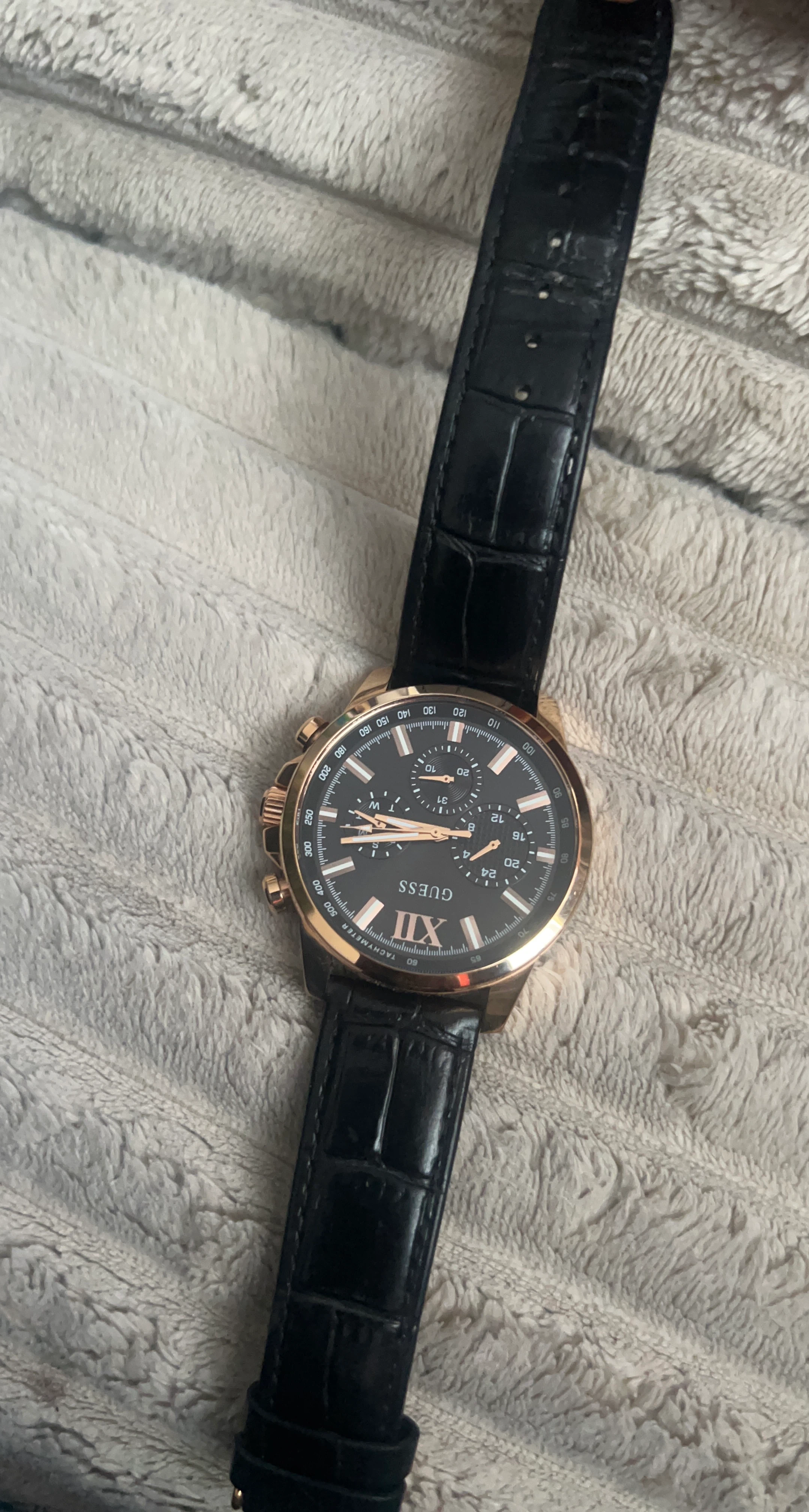 Guess rose gold tone chronograph watch with black strap