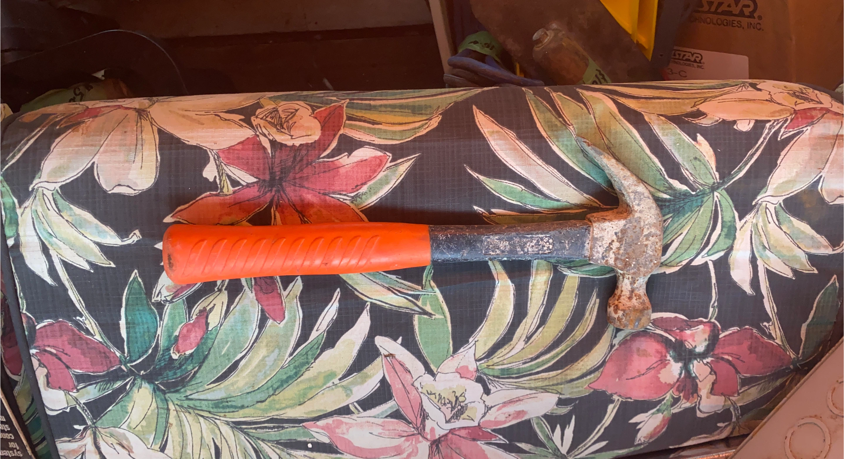 Steel claw hammer with orange grip