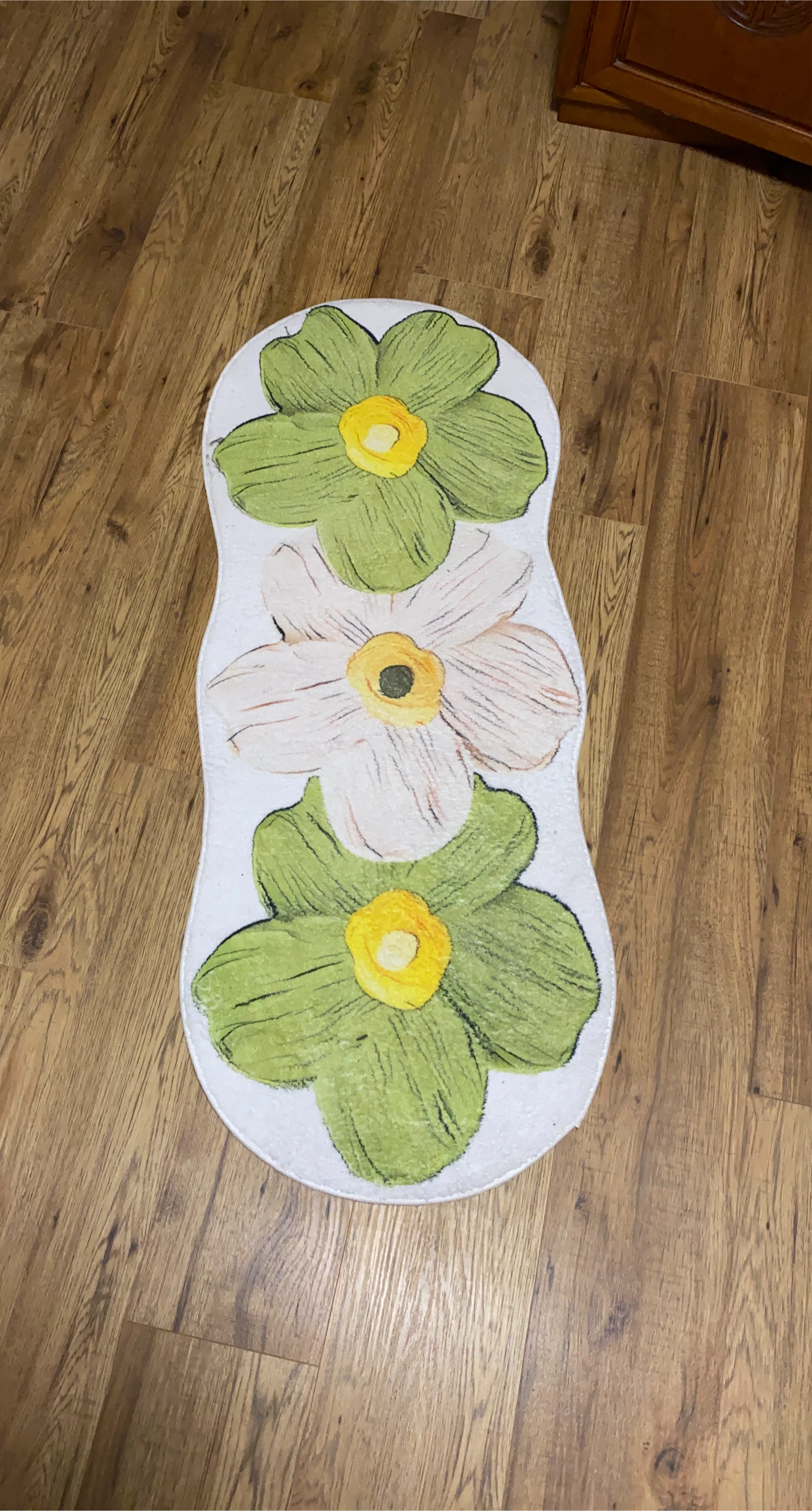 Green and white floral runner rug