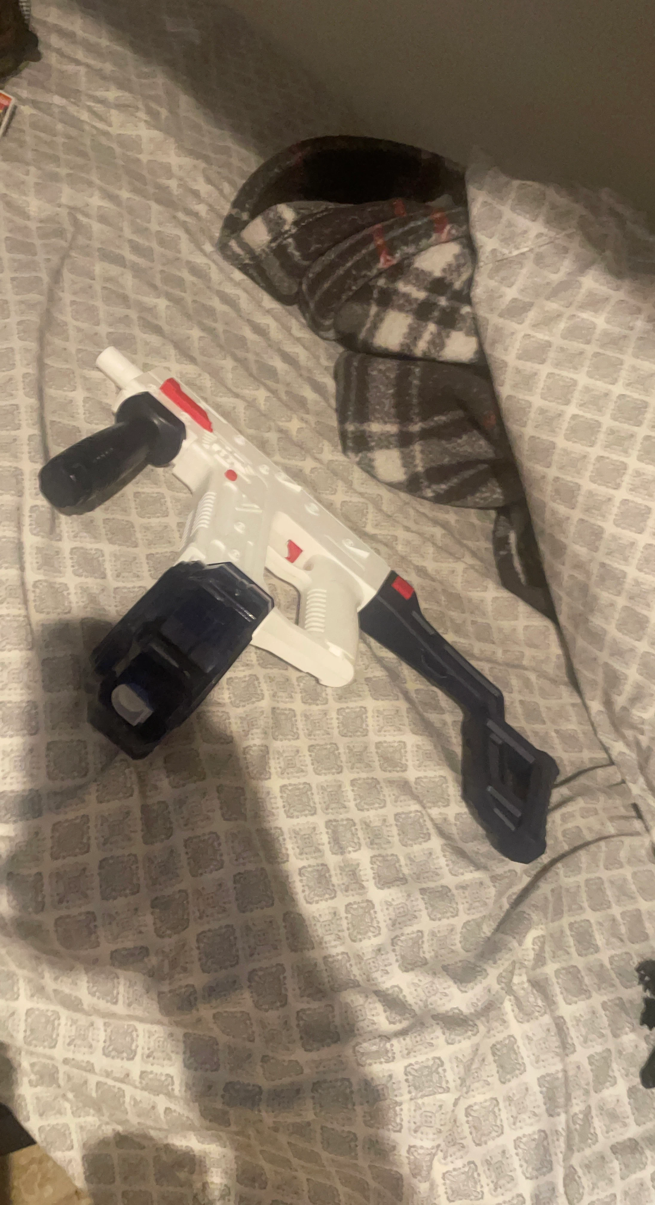 White and Blue Toy Blaster
