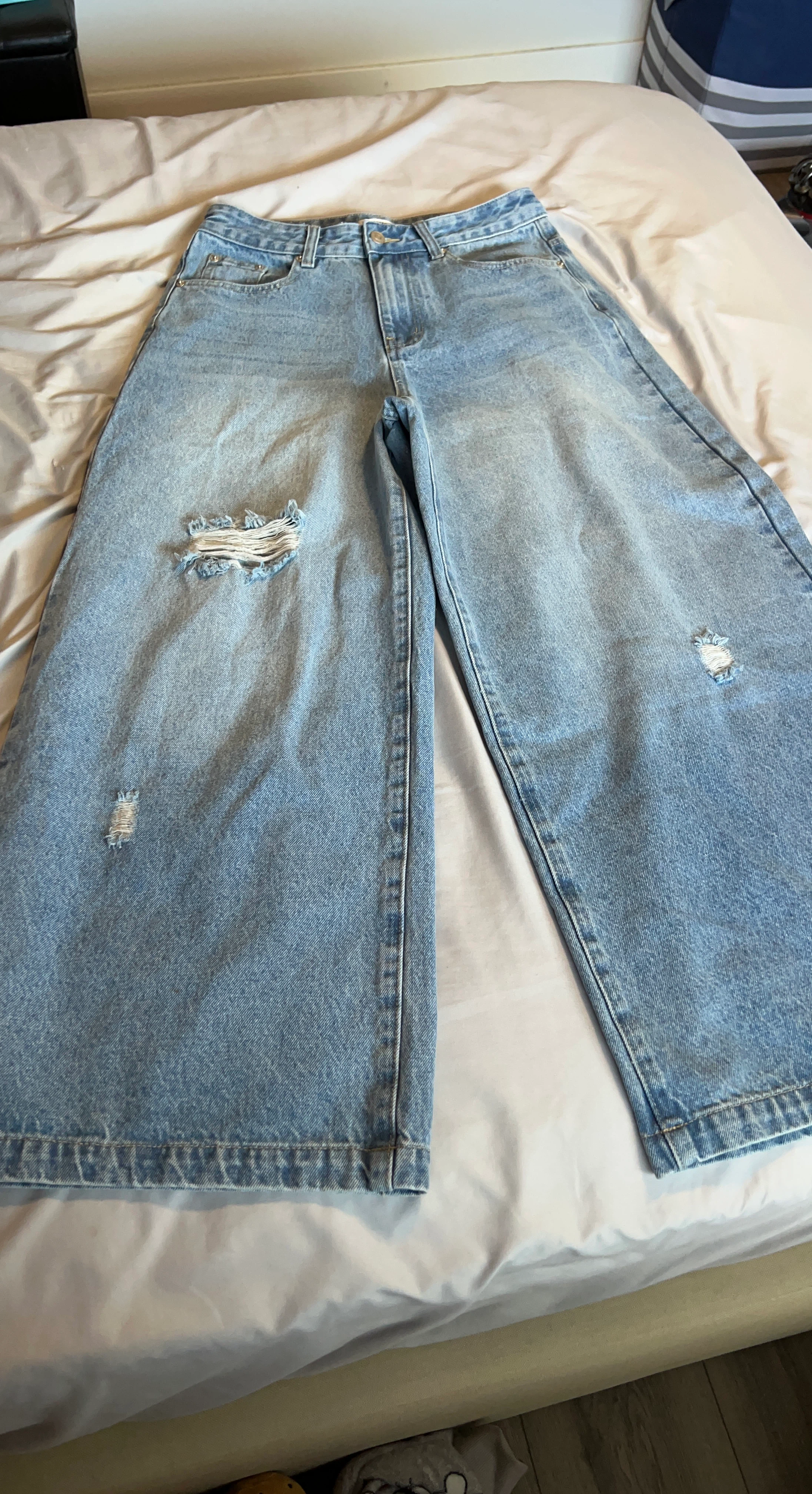 Wide leg distressed denim jeans