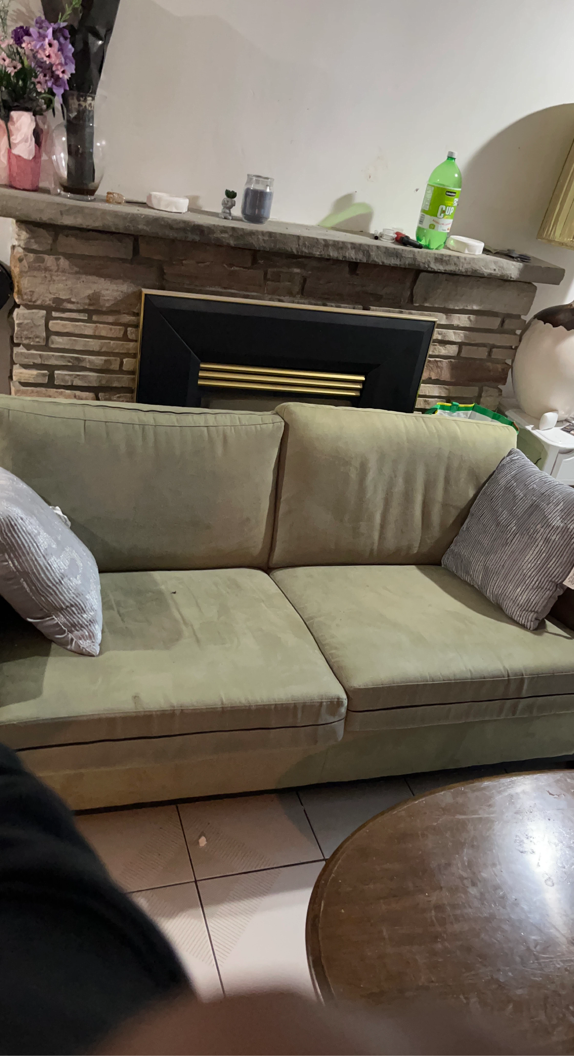 Green Sofa with Throw Pillows