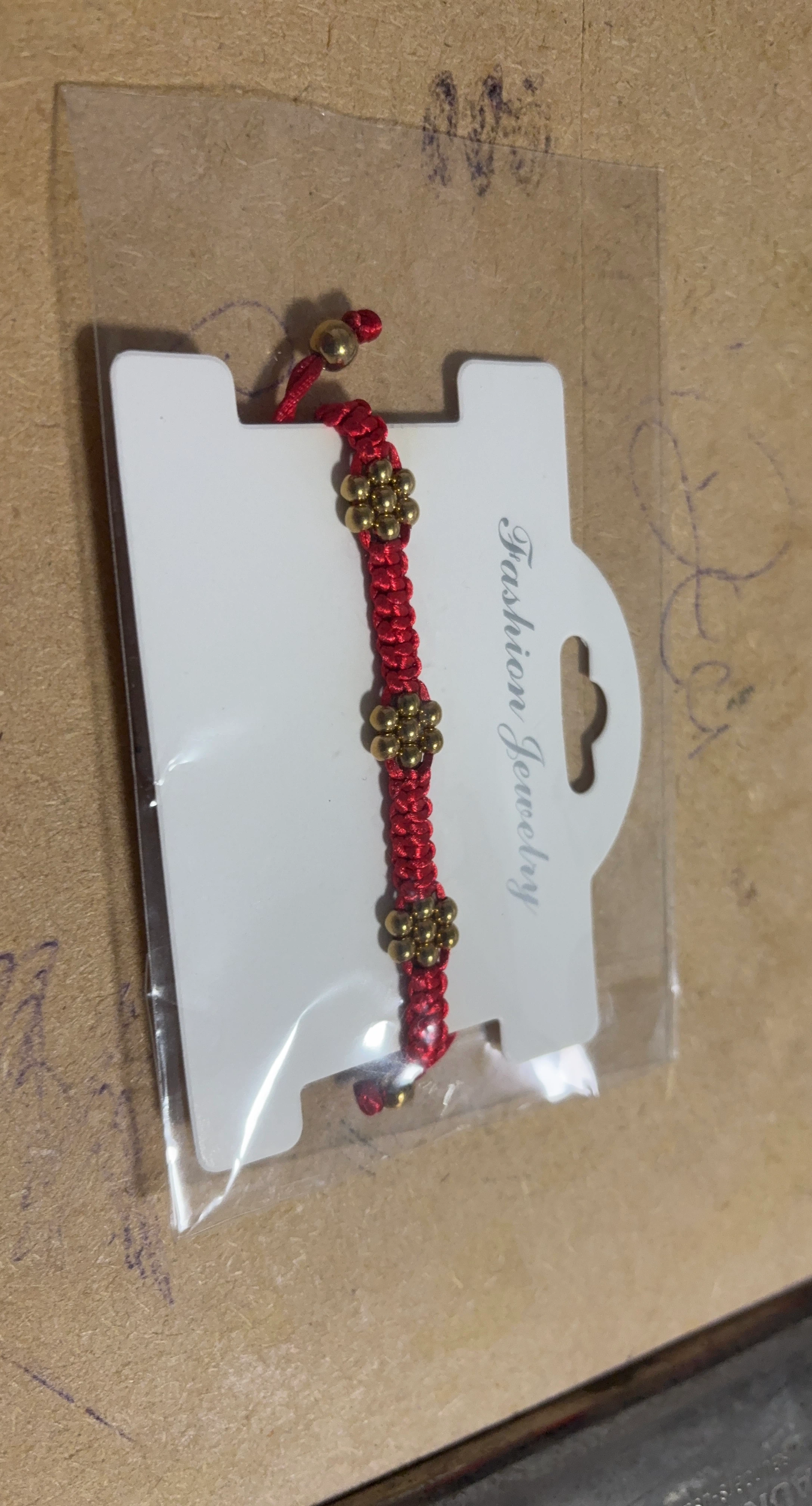 Red Cord Bracelet with Gold Beads
