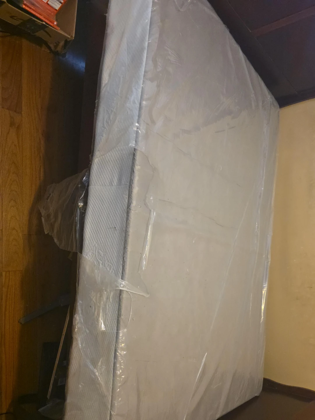 Mattress in plastic wrap