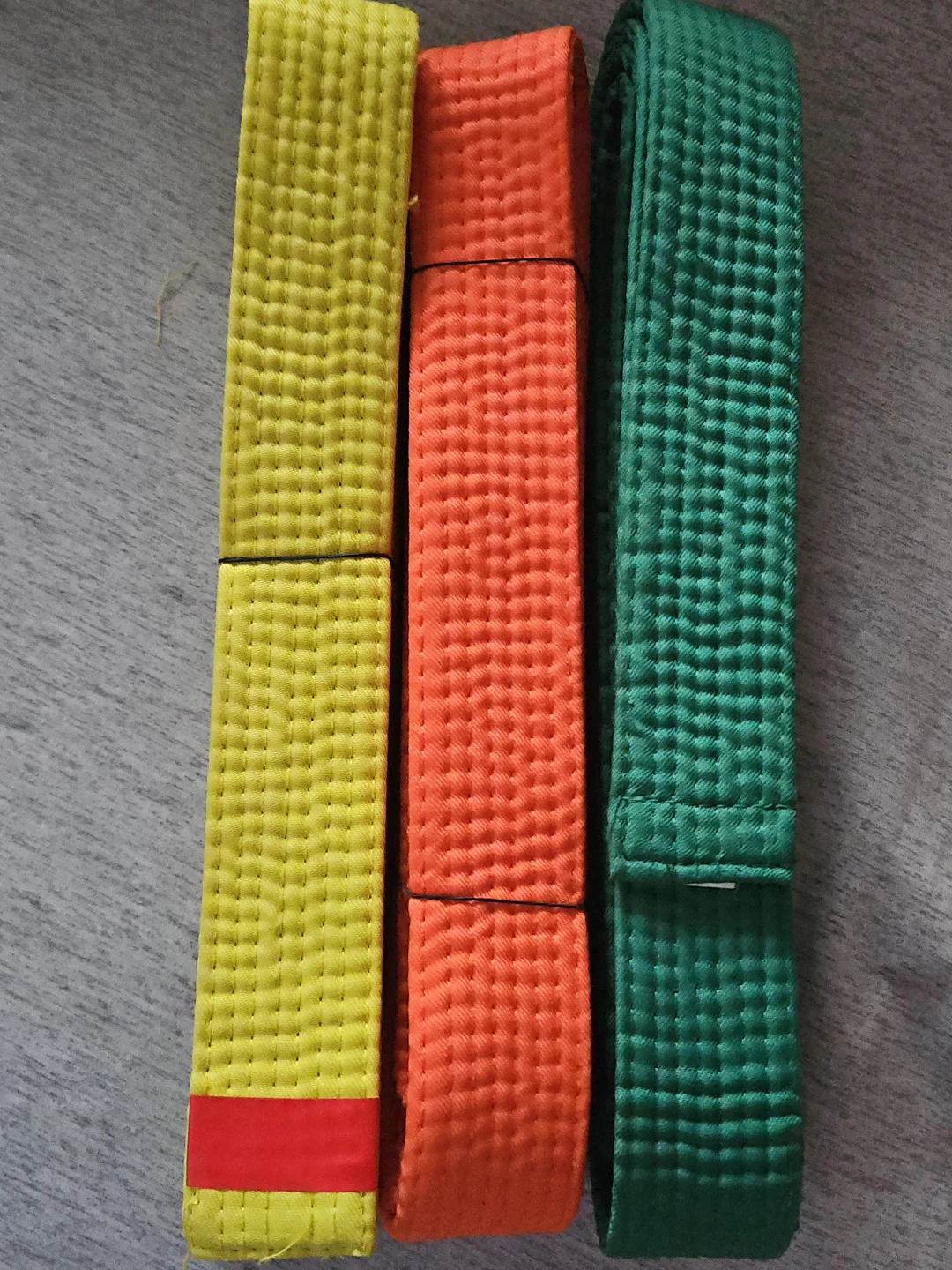 Yellow, Orange, and Green Martial Arts Belts