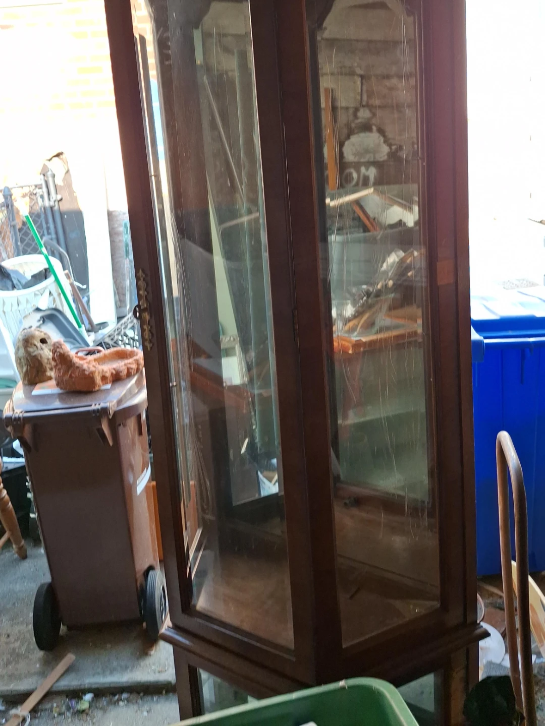Wooden curio cabinet with glass doors