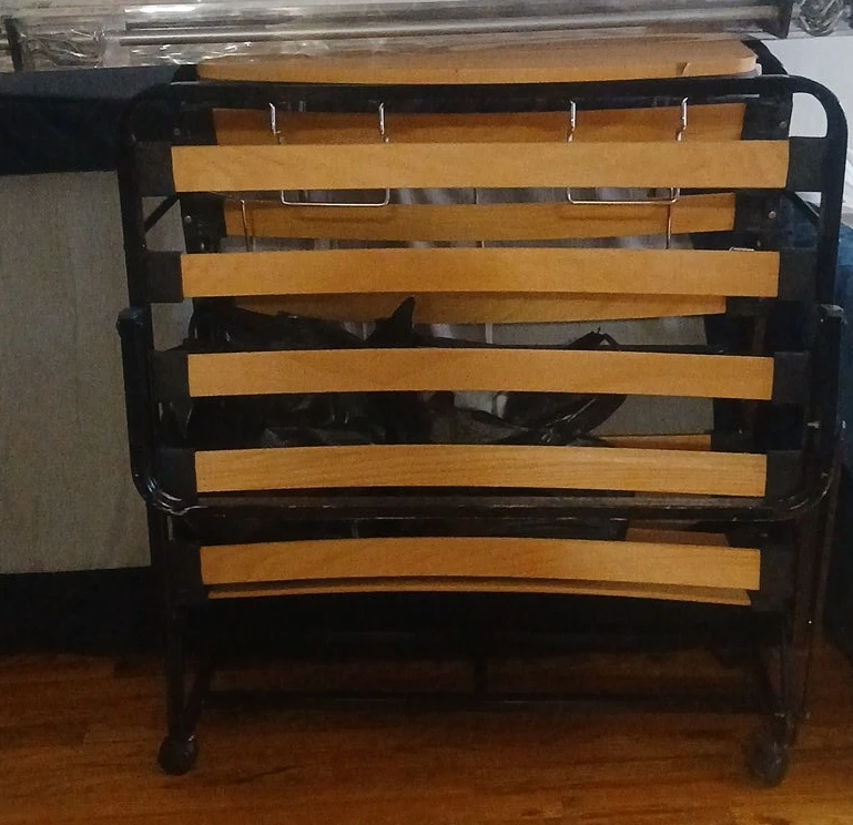 Folding metal and wood bed frame with wheels