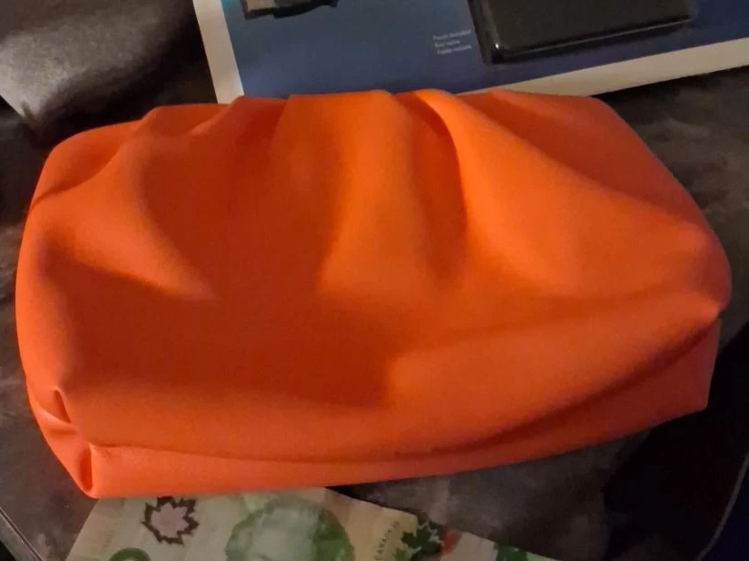 Orange ruched clutch purse
