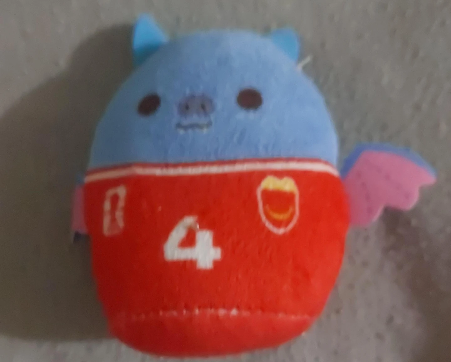 Blue and Red Plush Toy with Wings