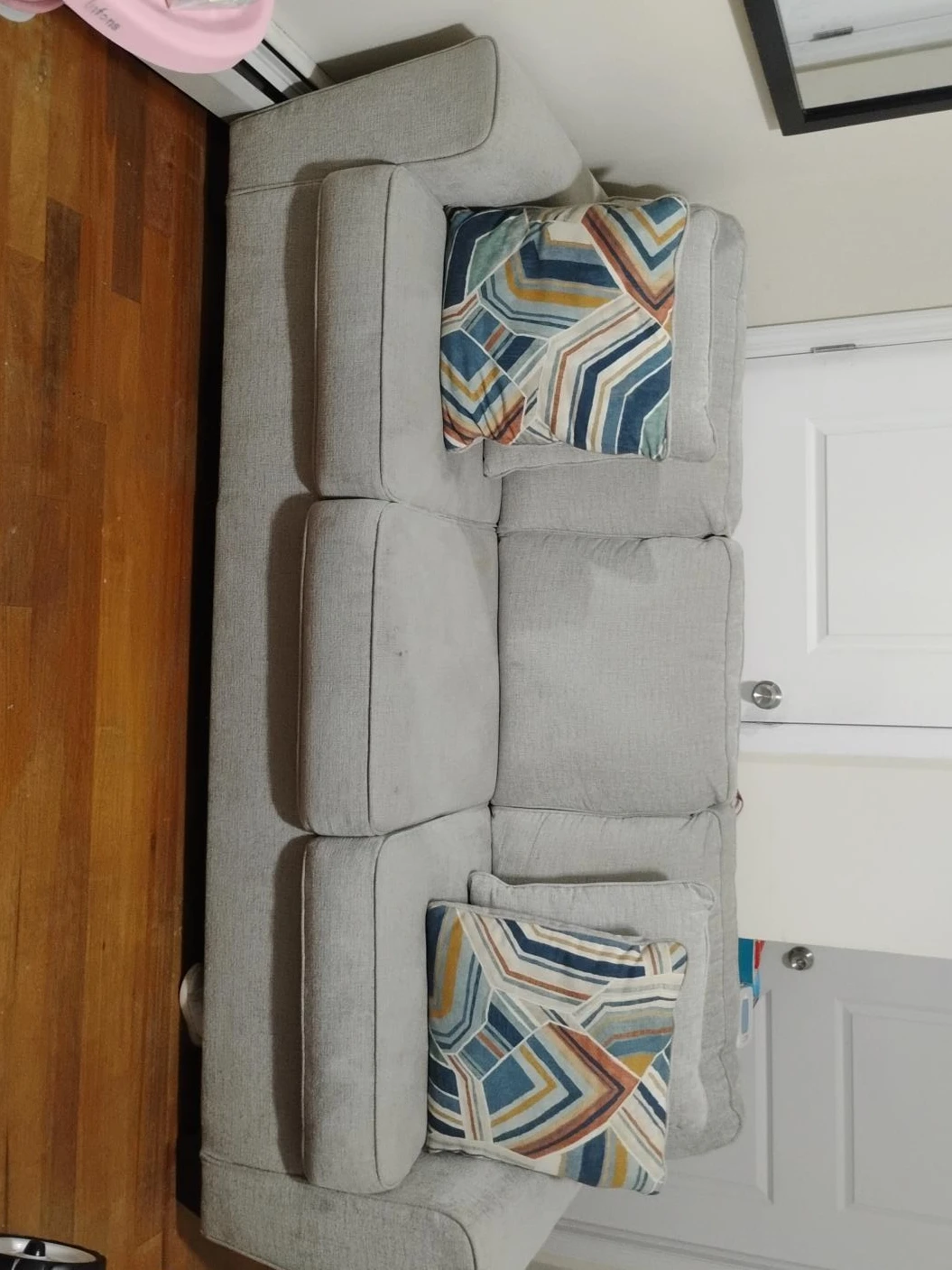 Light Gray Sectional Sofa with Geometric Pillows