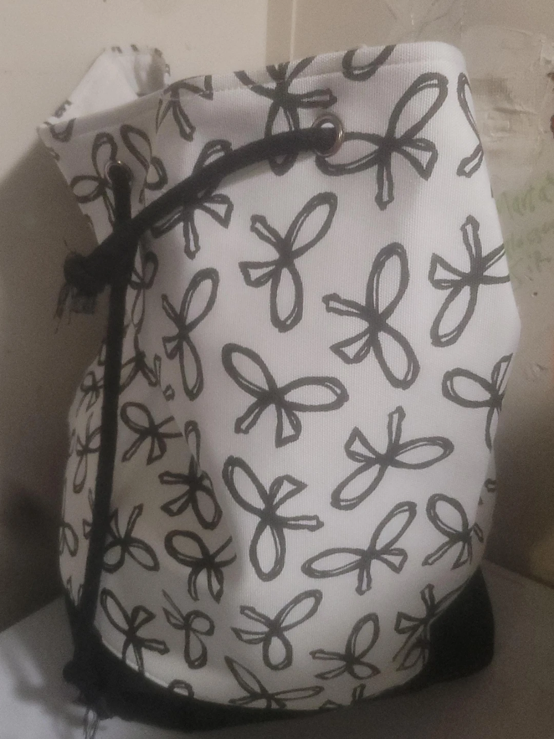 White and Black Drawstring Laundry Bag with Floral Pattern