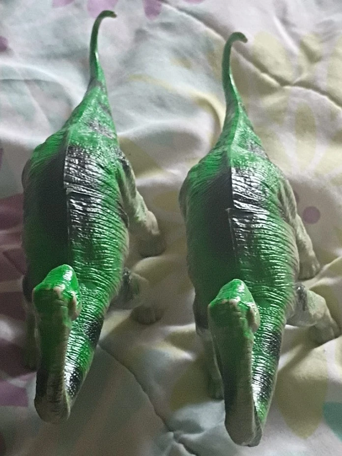 Two Green Dinosaur Figurines