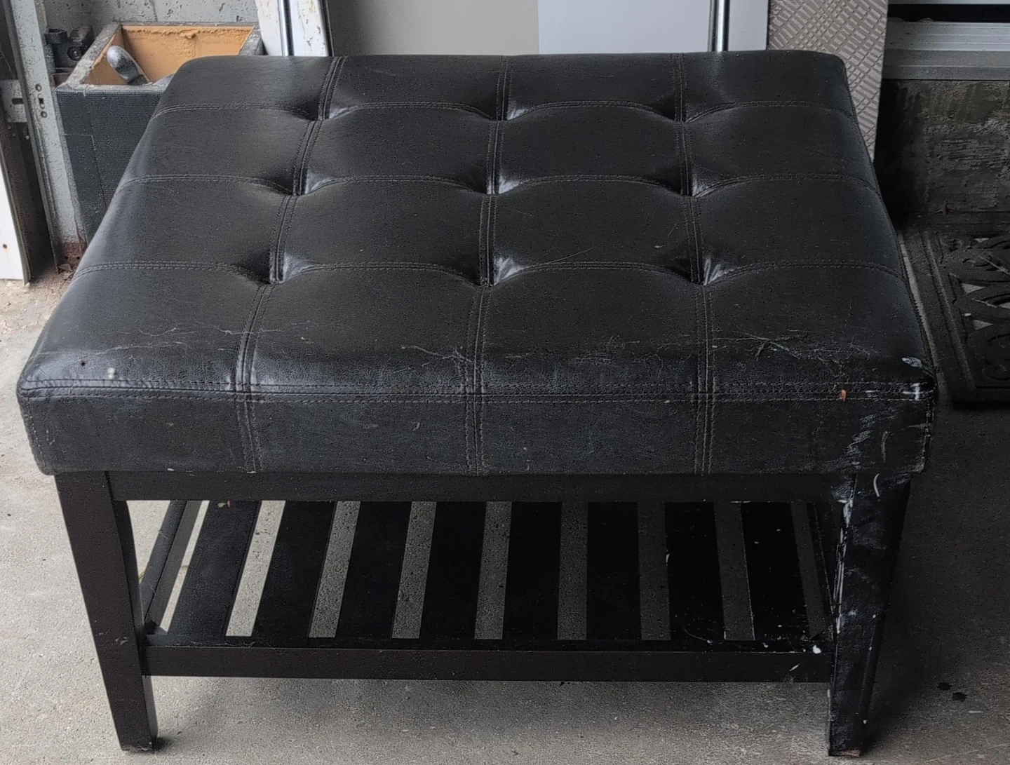 Black Tufted Faux Leather Ottoman with Shelf