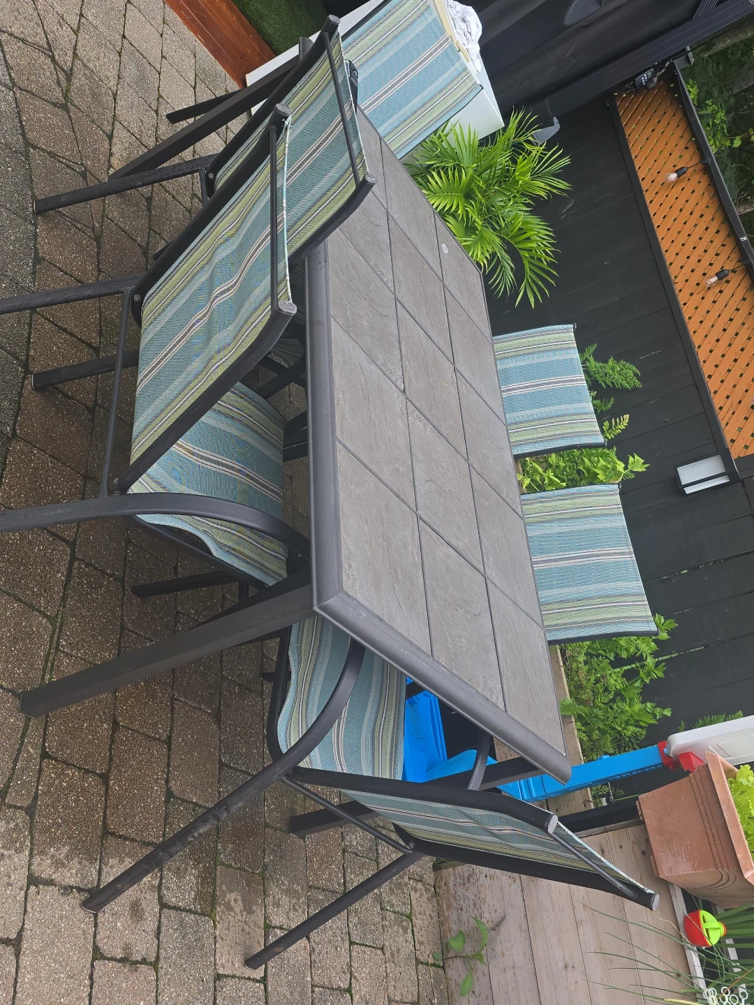 Patio Dining Set with Tile Table and Striped Cushions