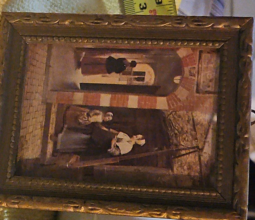 Pair of small framed decorative pictures