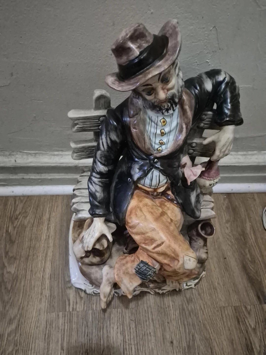 Ceramic Hobo Figurine Sitting on Bench