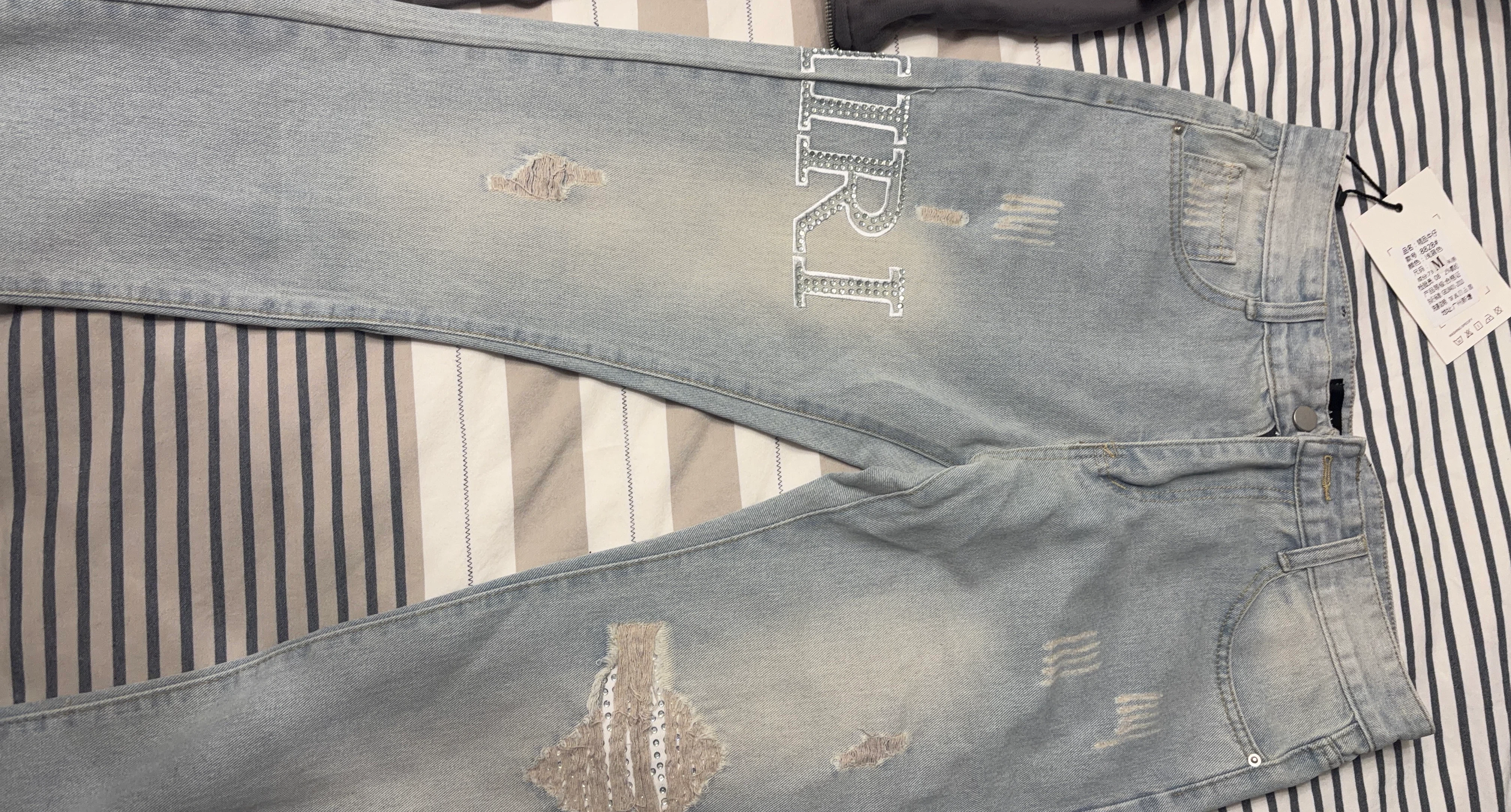 Amiri light wash denim jeans