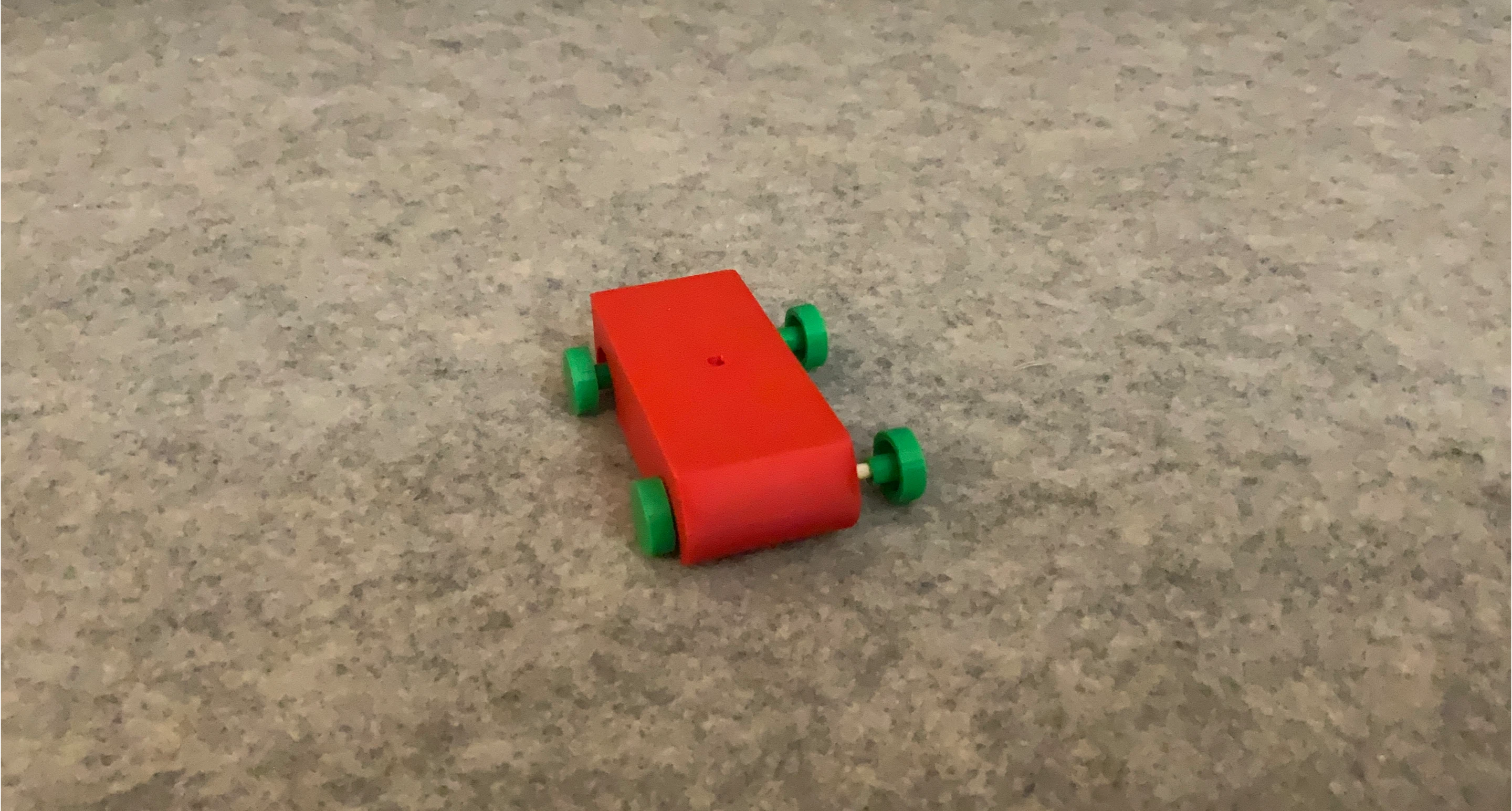 Red Toy Car with Green Wheels