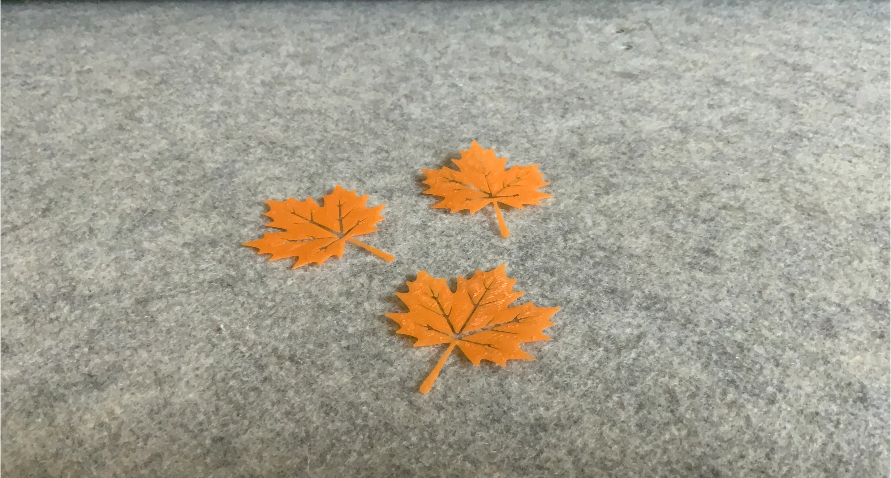 Three Orange Maple Leaf Decor Pieces