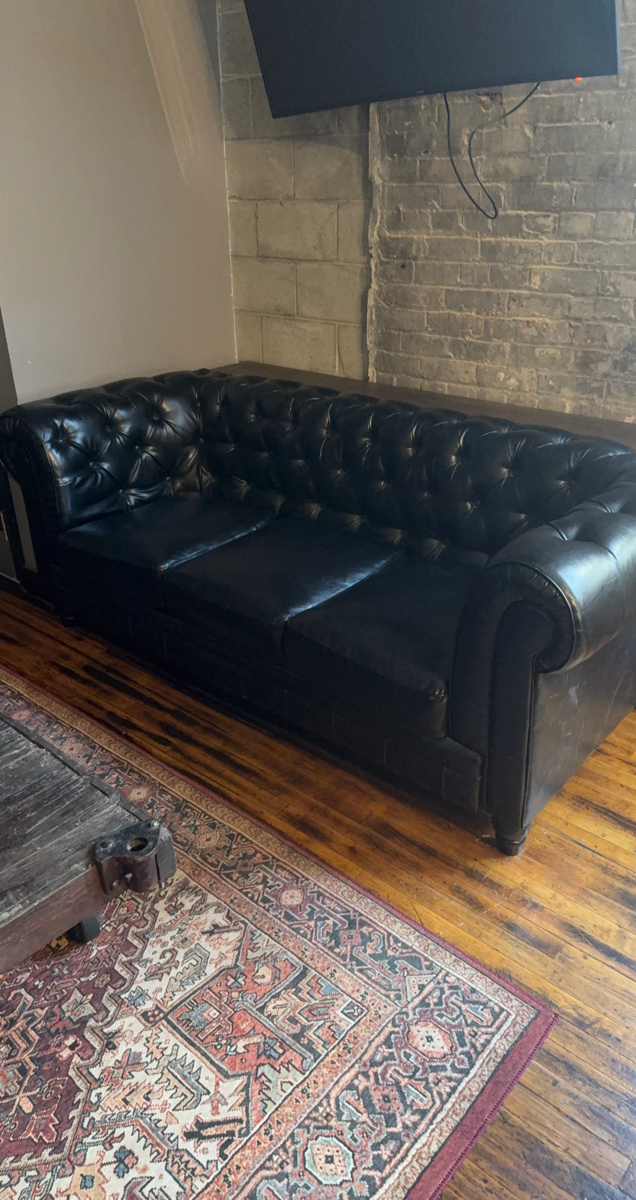 Black Leather Tufted Sofa