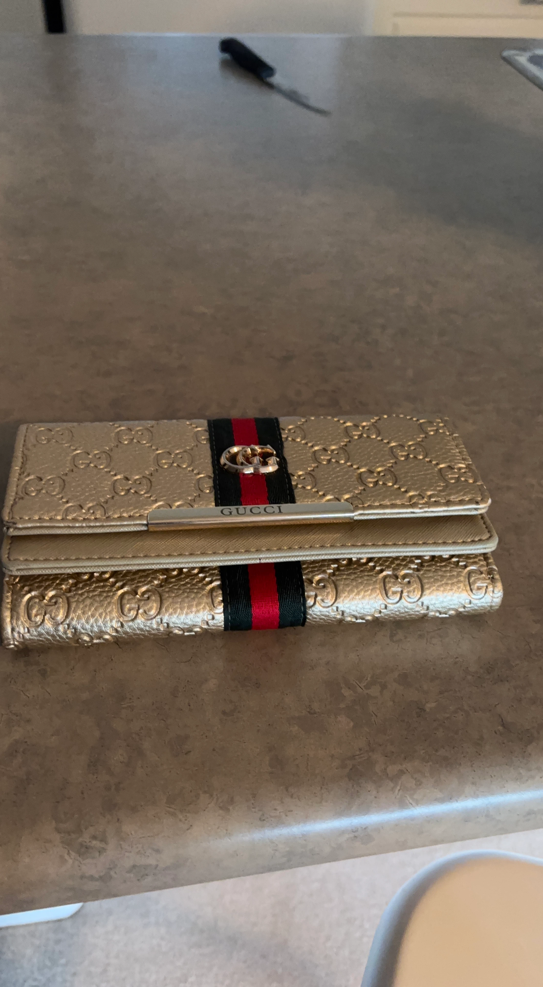 Gucci Gold GG Embossed Wallet
