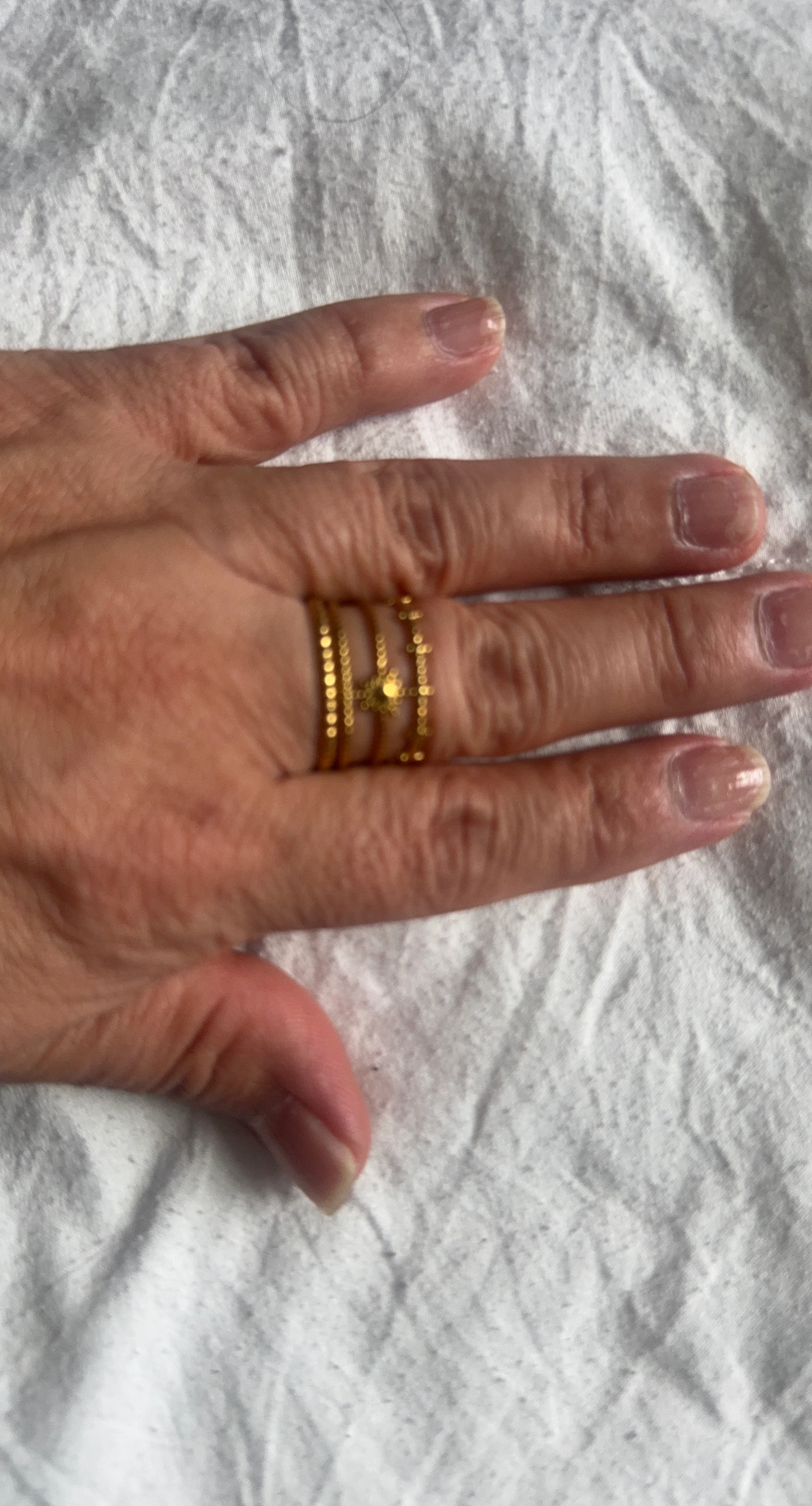 Gold ring set with decorative center
