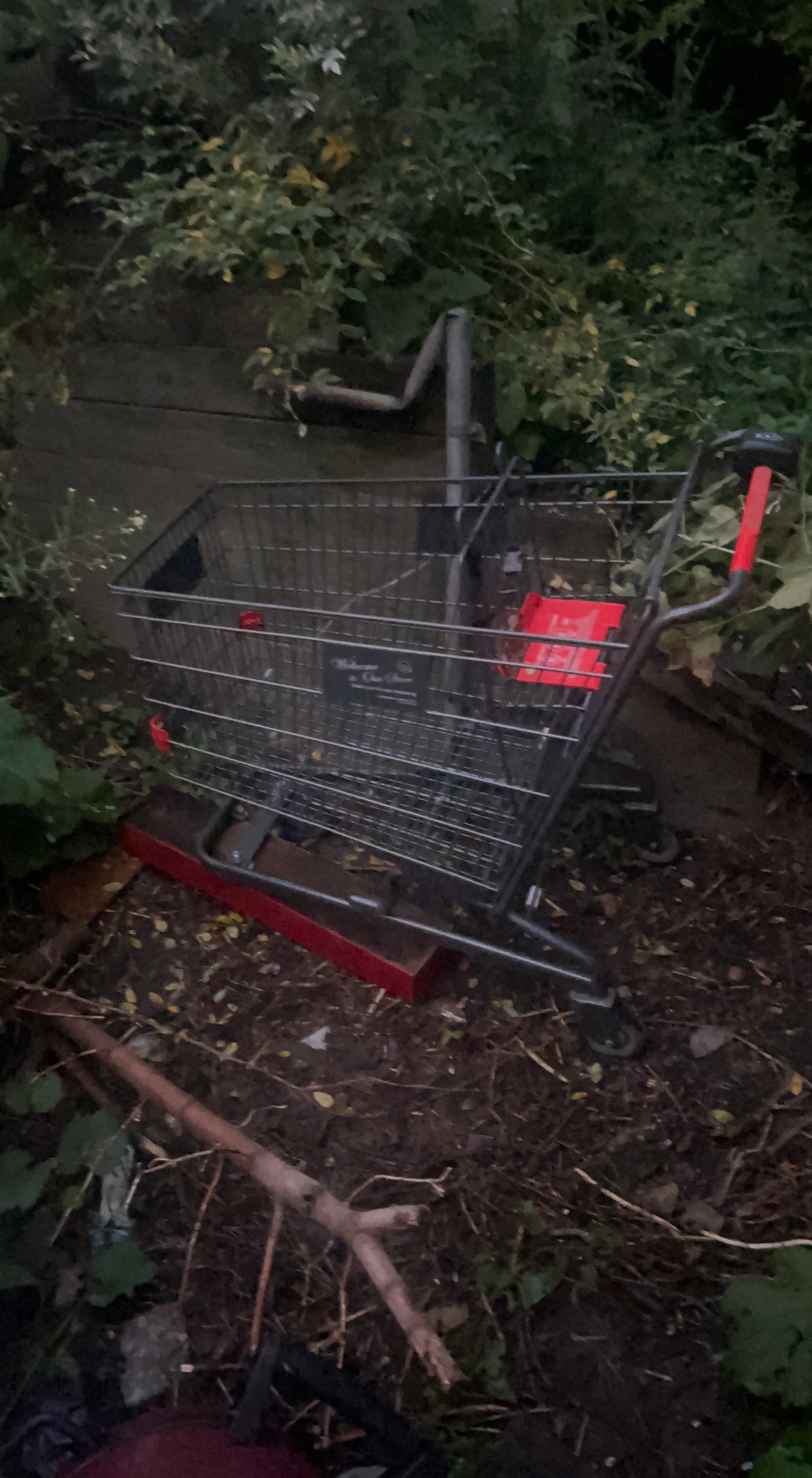 Metal Shopping Cart with a missing wheel