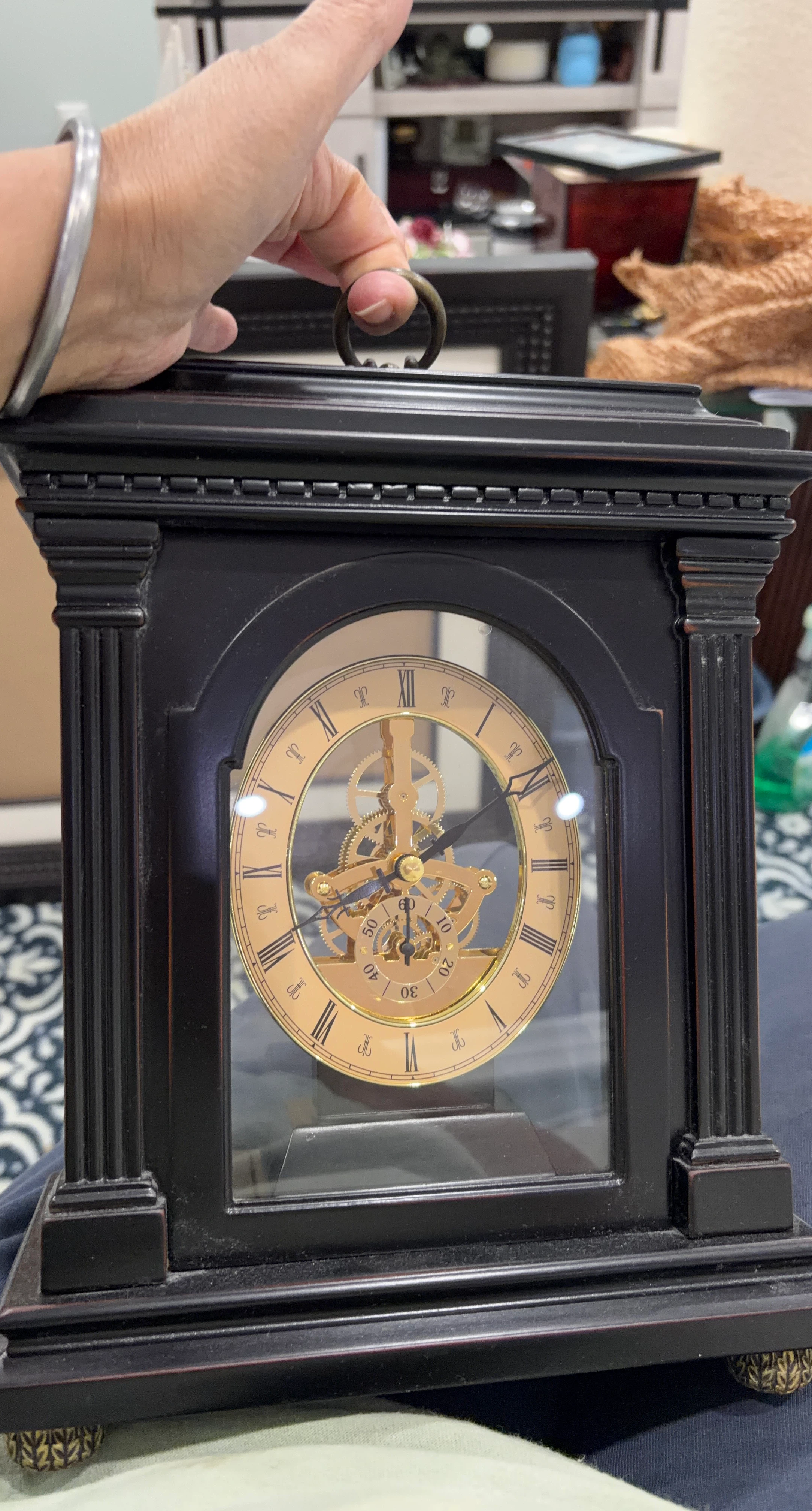 Vintage-style black mantel clock with skeleton movement