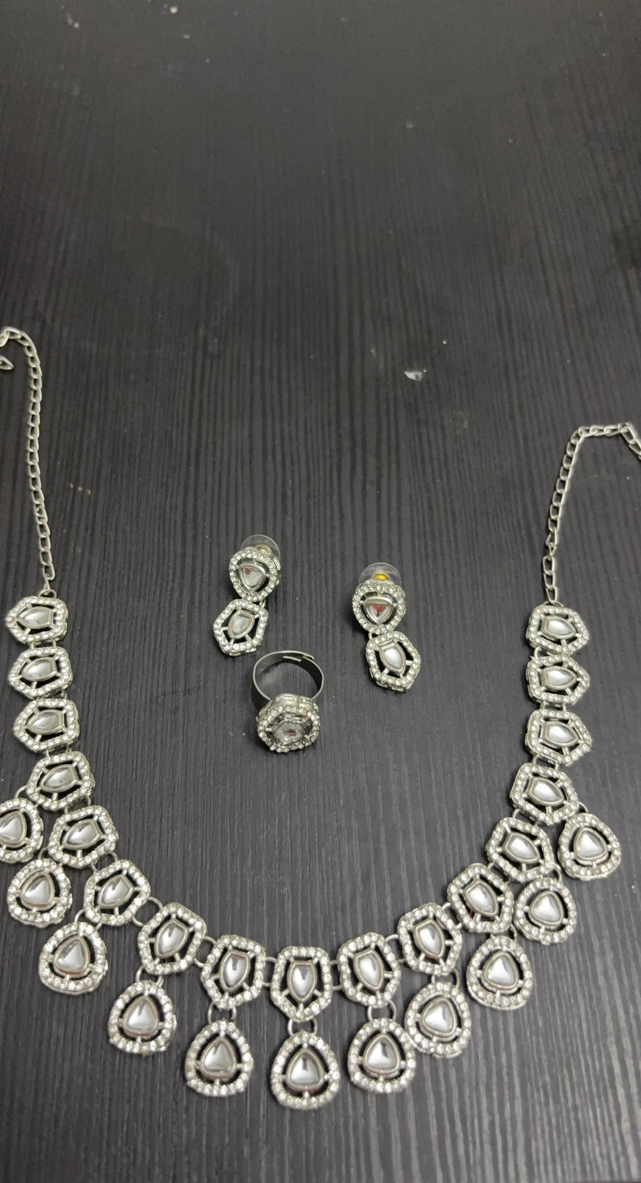 Silver-toned statement necklace, earring, and ring set