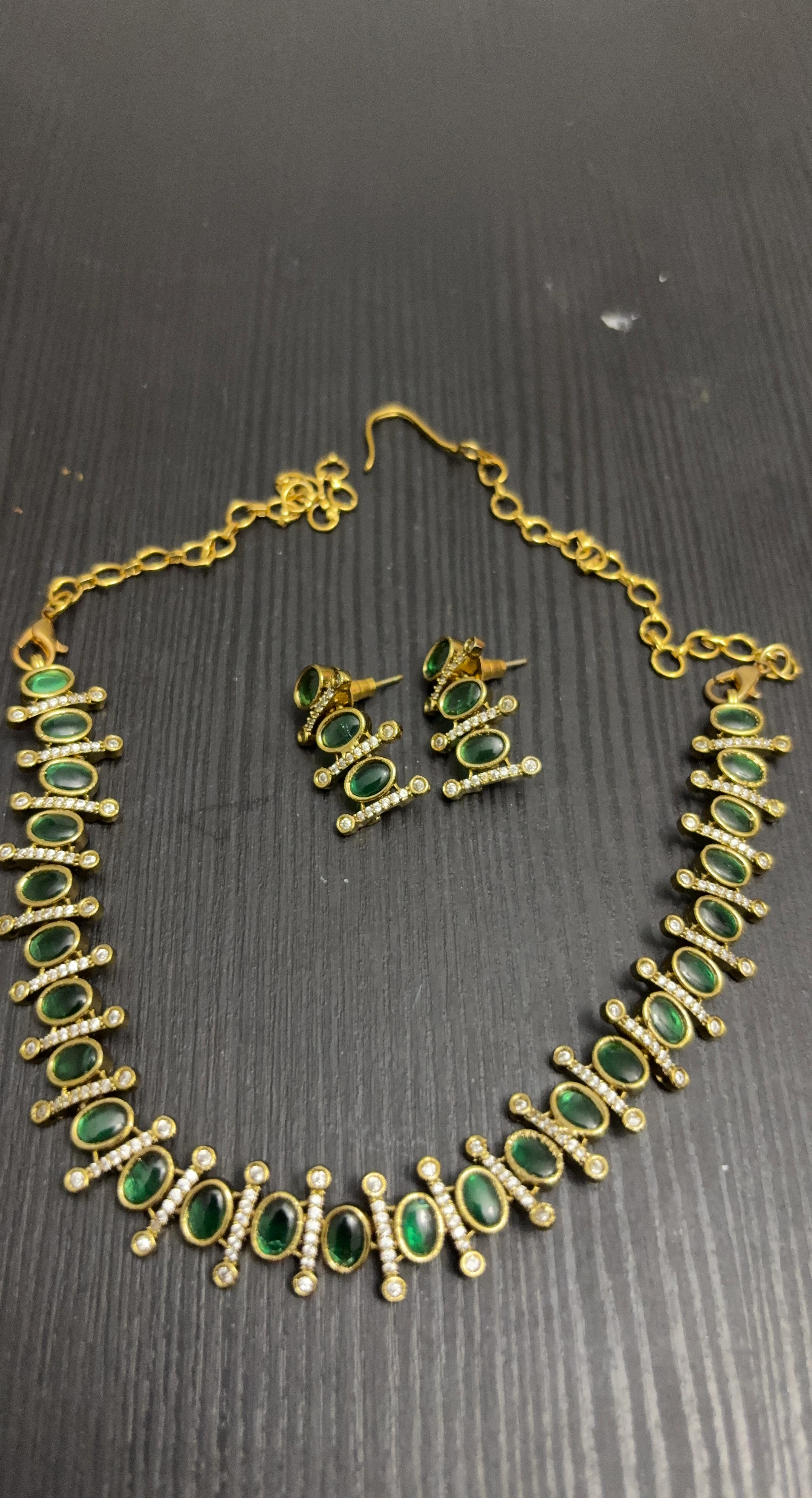 Gold-tone necklace and earring set with green stones