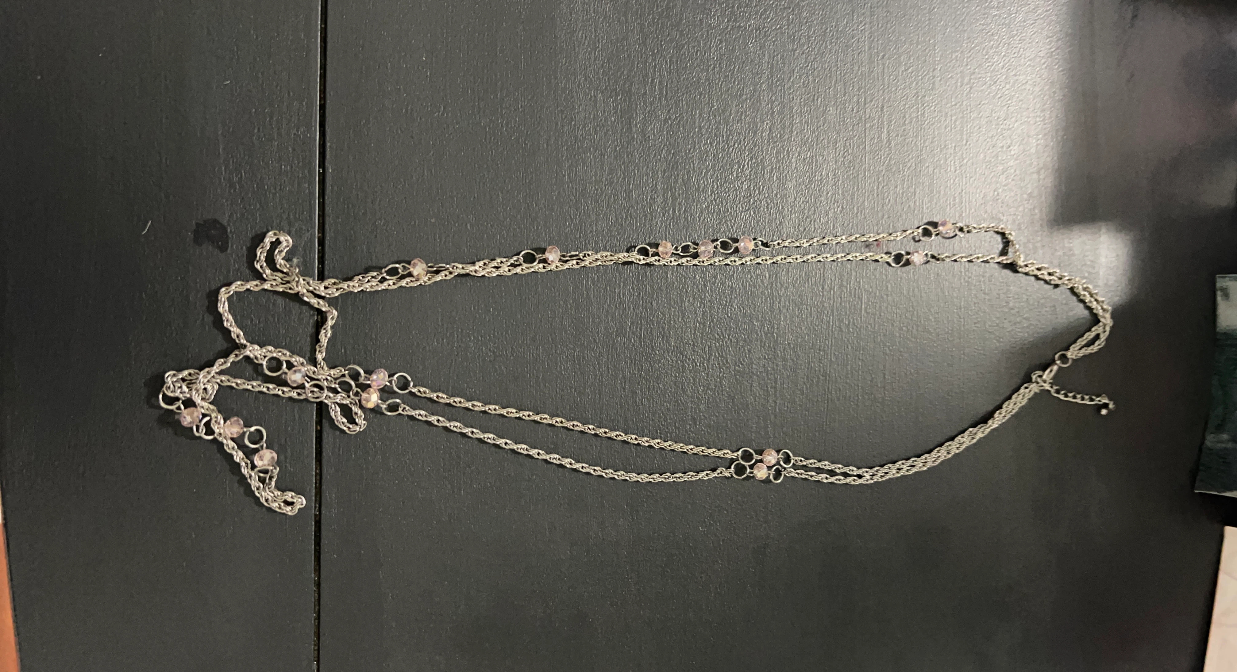 Layered gold-tone necklace with pink crystals