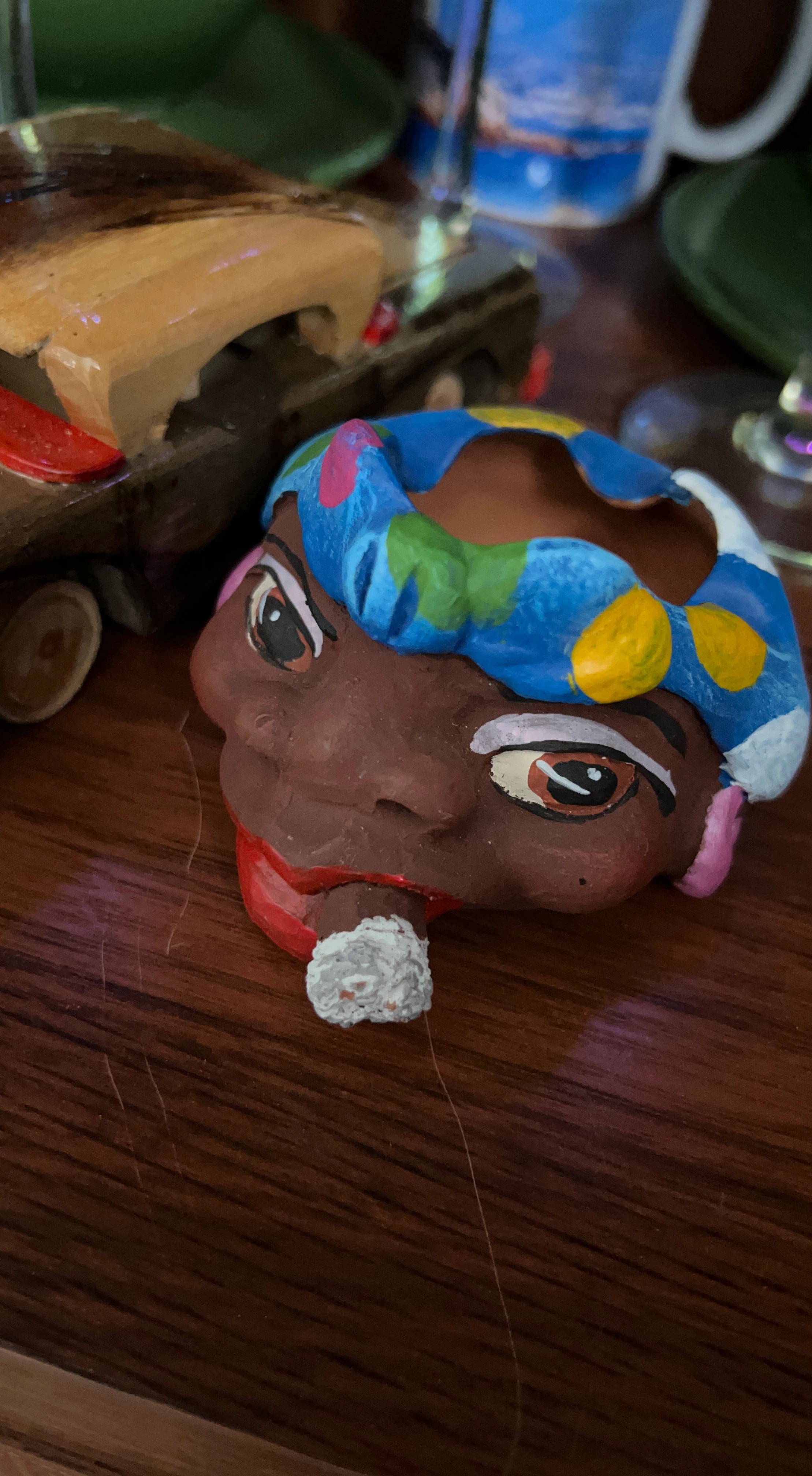 Hand-painted clay head ashtray