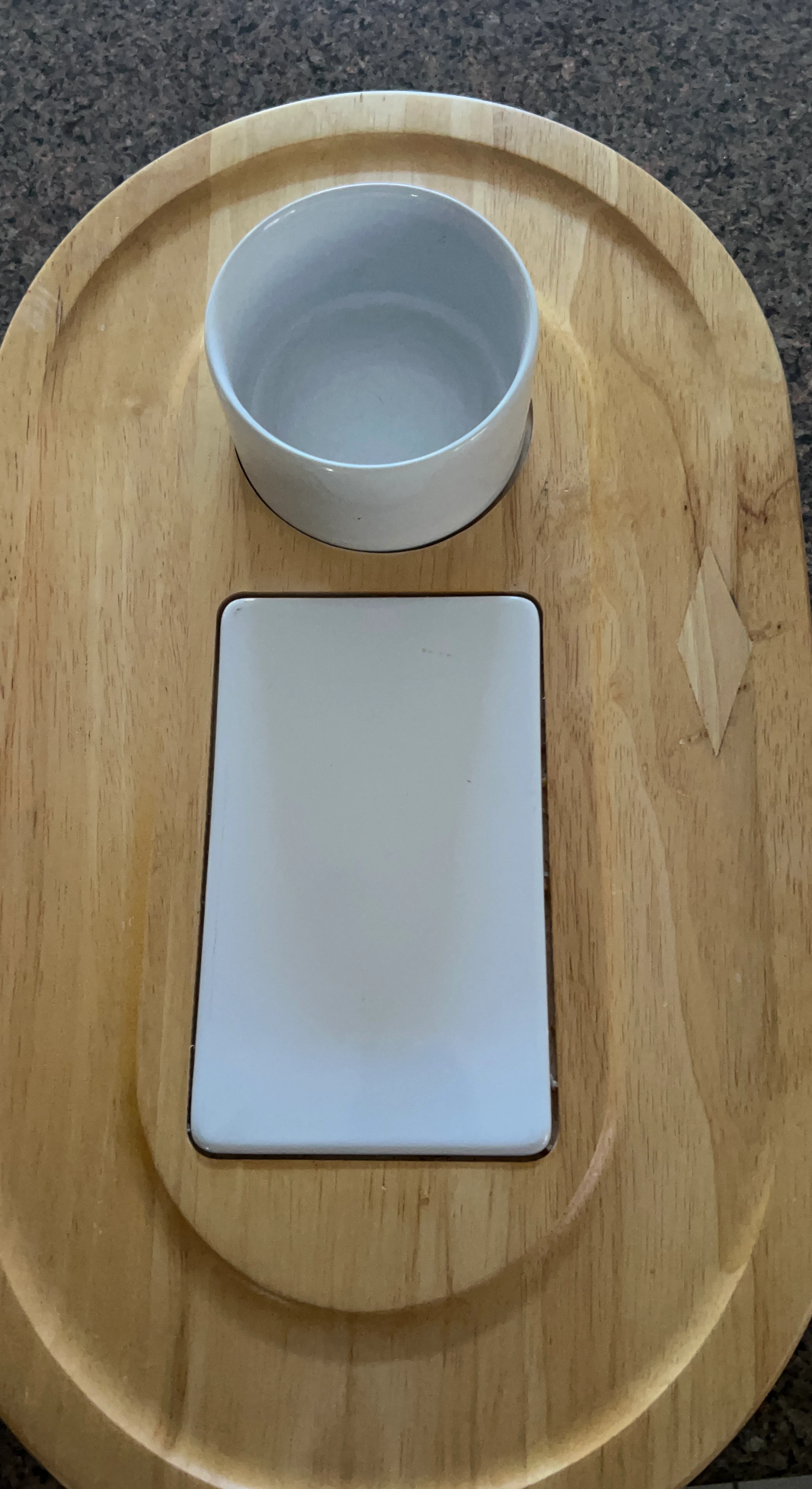 Cheese and crackers board with bowl for crackers dip