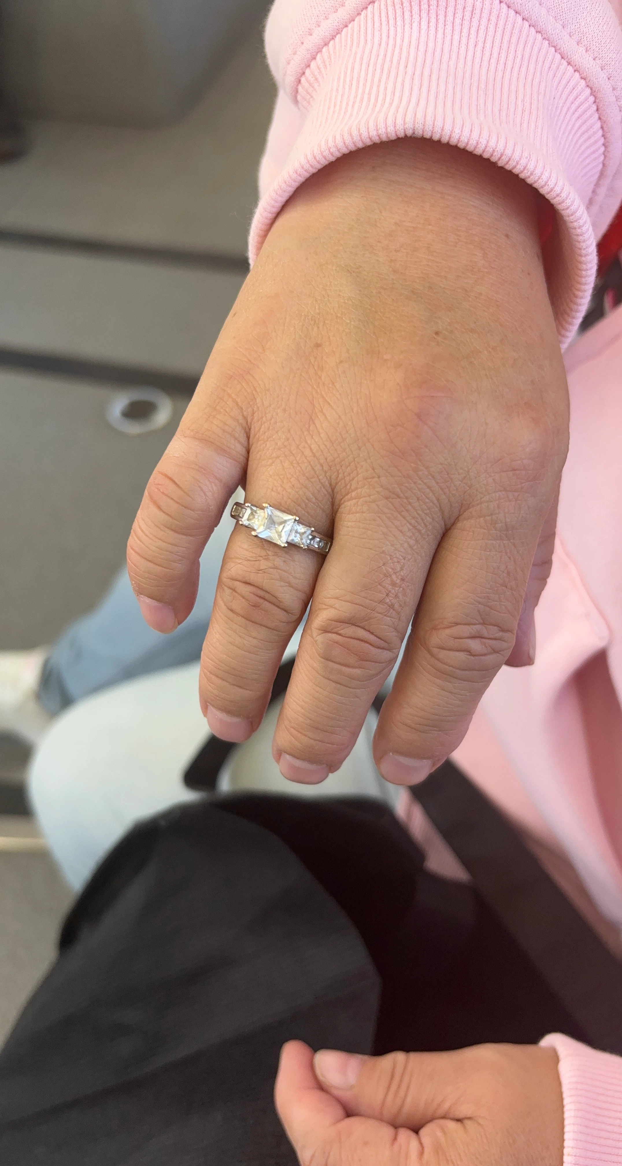 Three-stone princess cut engagement ring