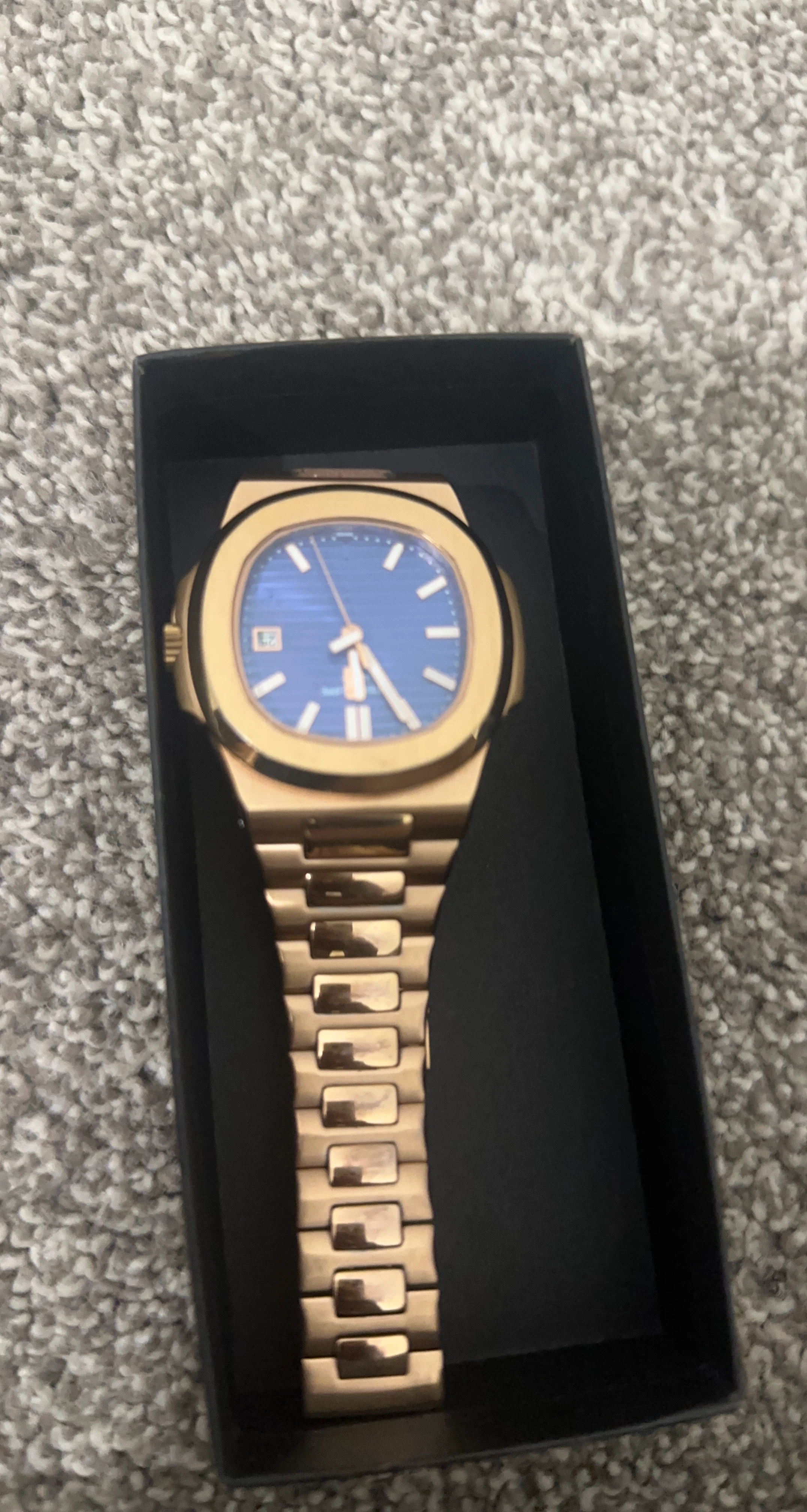 Gold-tone watch with blue face