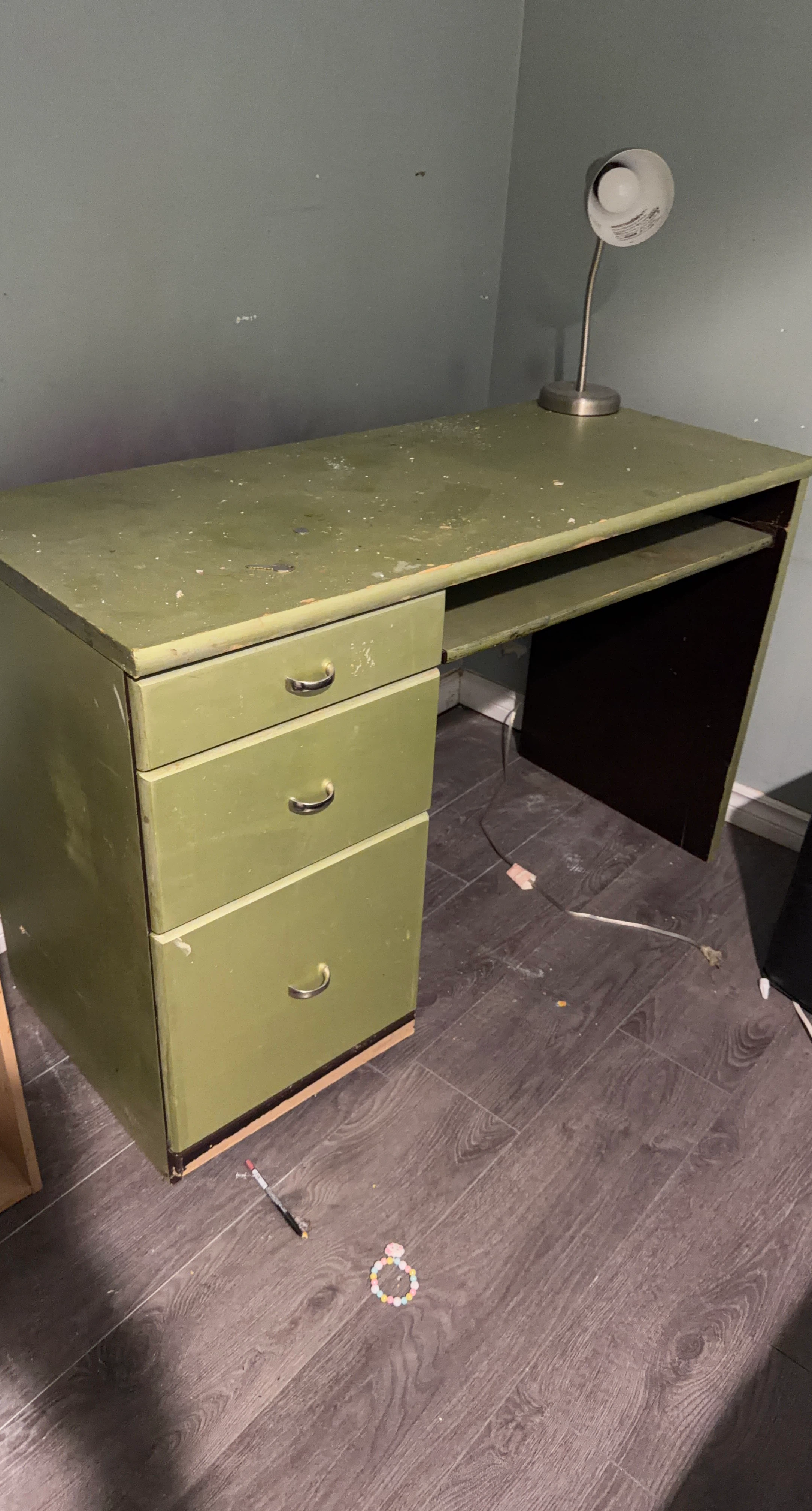 Green desk with three drawers