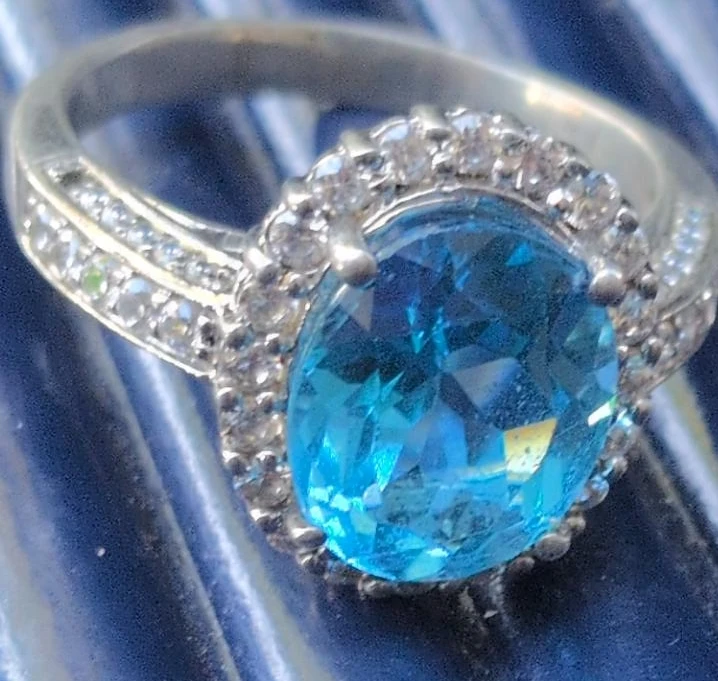 Blue Oval Stone Ring with Halo Setting