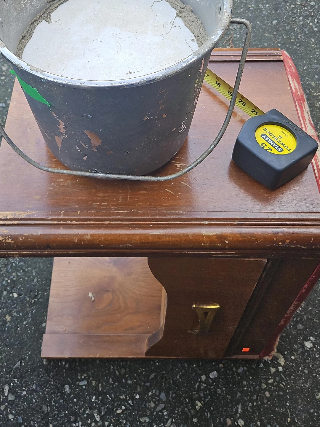 Metal bucket with concrete base